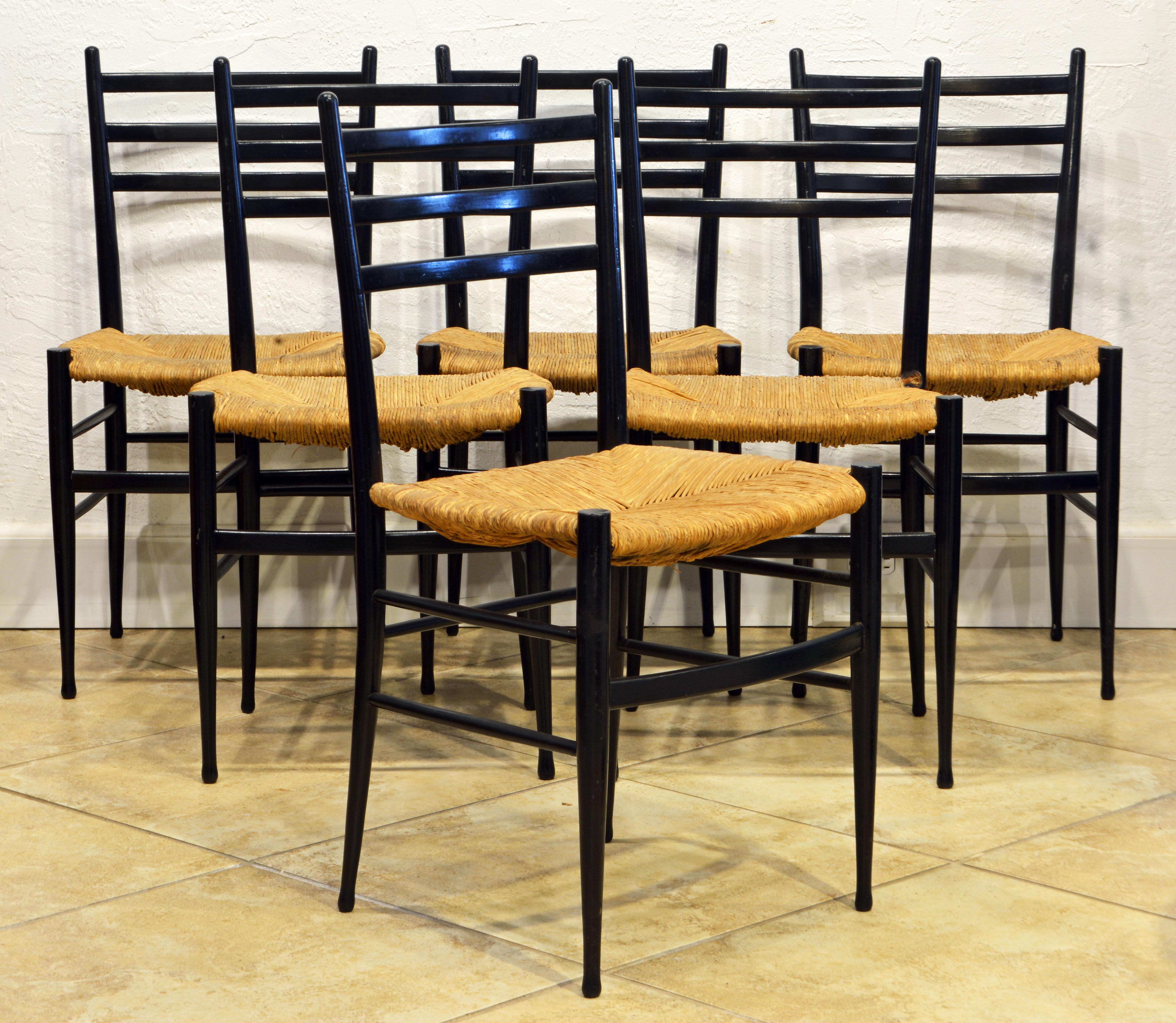 In spite of the small frame dimensions these Italian dining chairs are amazingly sturdy thanks to a brilliant design. They are elegant minimalist chairs and the rush seats add a touch of southern charm. The chairs are all embossed with 'Made in