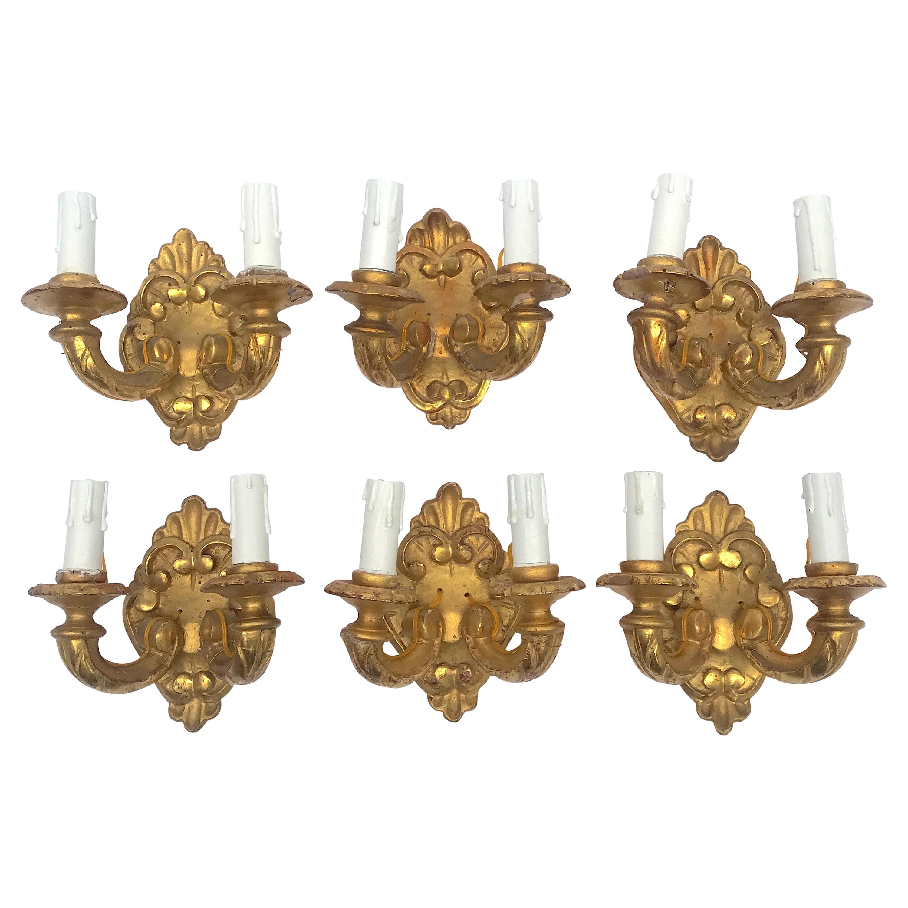 Six Italian Gilded Sconces Six Giltwood Two-Armed Wall Lights, 19th Century