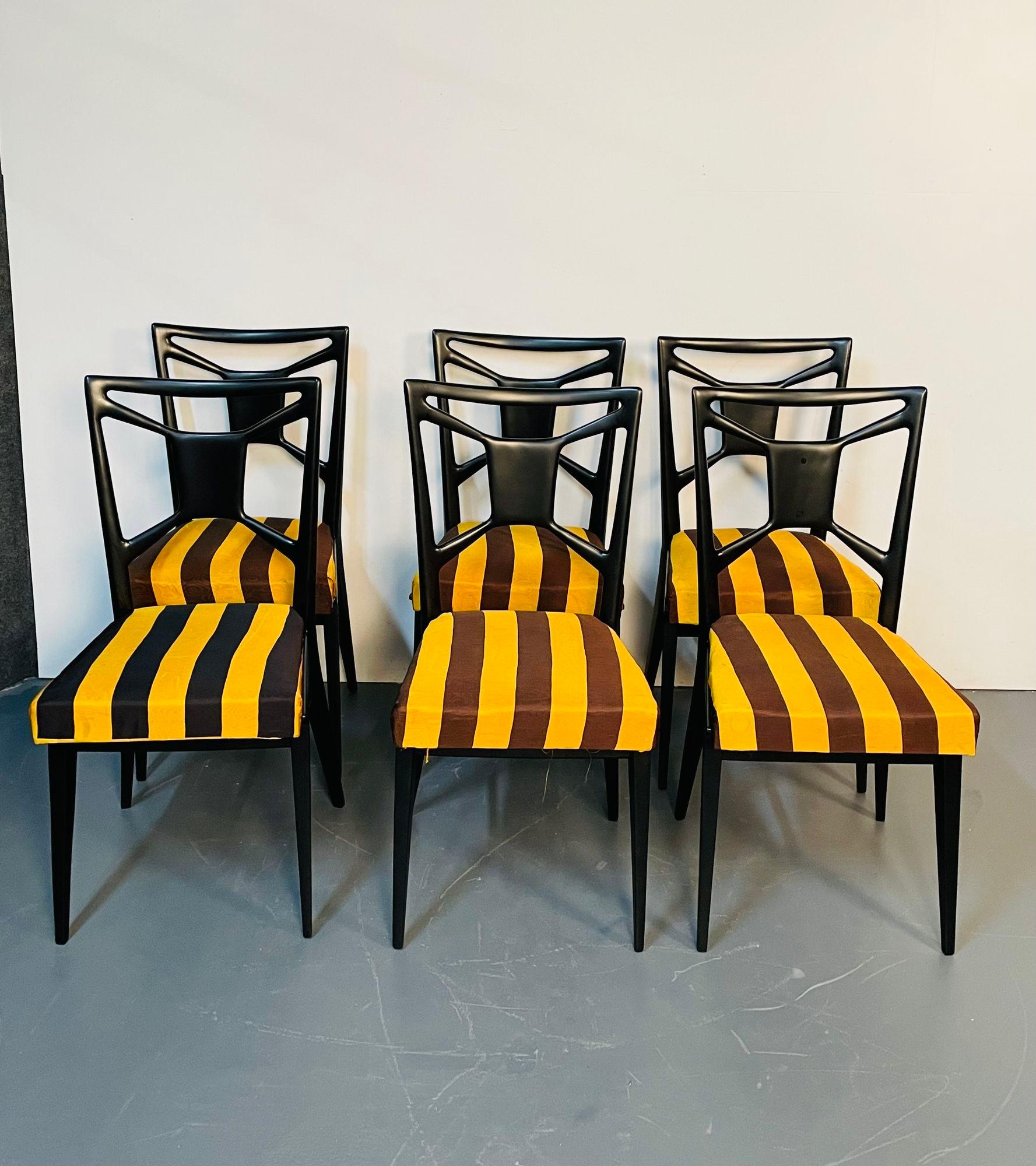 Six Italian Mid-Century Modern mahogany dining / side chairs, Ico Parisi Style
 
Six solid dark mahogany wood dining or accent chairs having 'X' form backs and comfortable striped fabric seats. Each chair sits on four slightly tilted legs for
