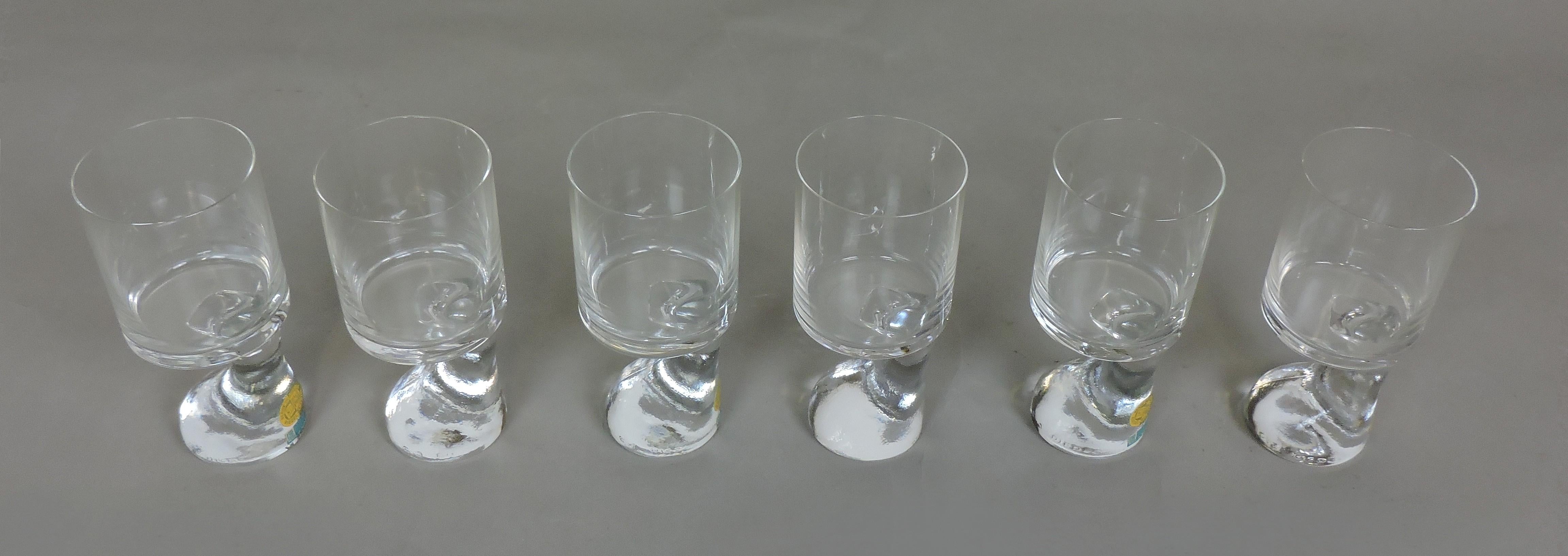 Set of six very cool Assimetrico drinking glasses designed in 1964 by Joe Colombo and manufactured in Austria by Riedel. These glasses are made of crystal and were designed so that the user can hold a drink and a cigarette in one hand, and would