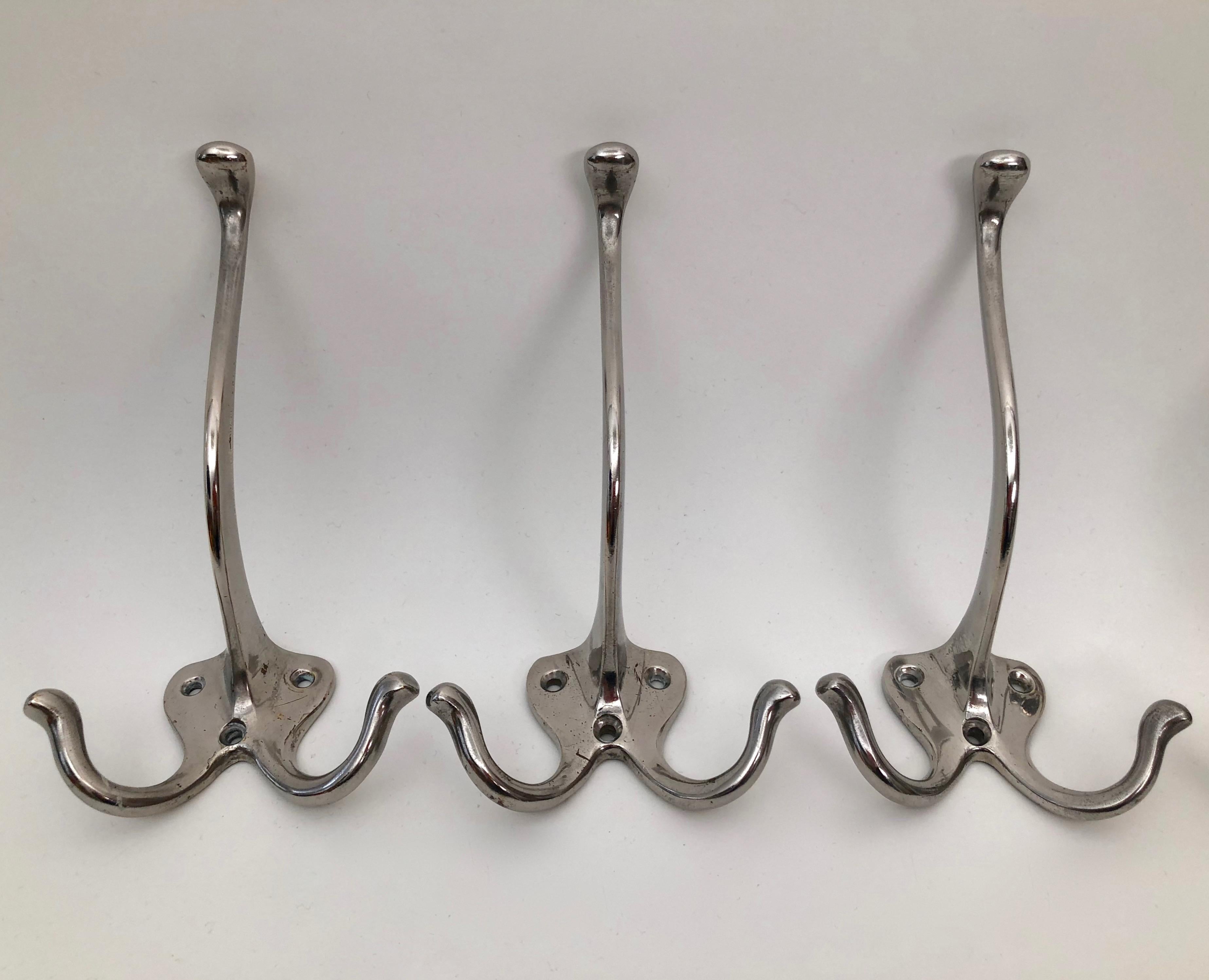 Six Jugendstil coat hooks for wall mounting. The hooks are made from cast iron and are nickel-plated. They were manufactured, circa
1900. The nickel platting is in very good condition with some wear from clothing.