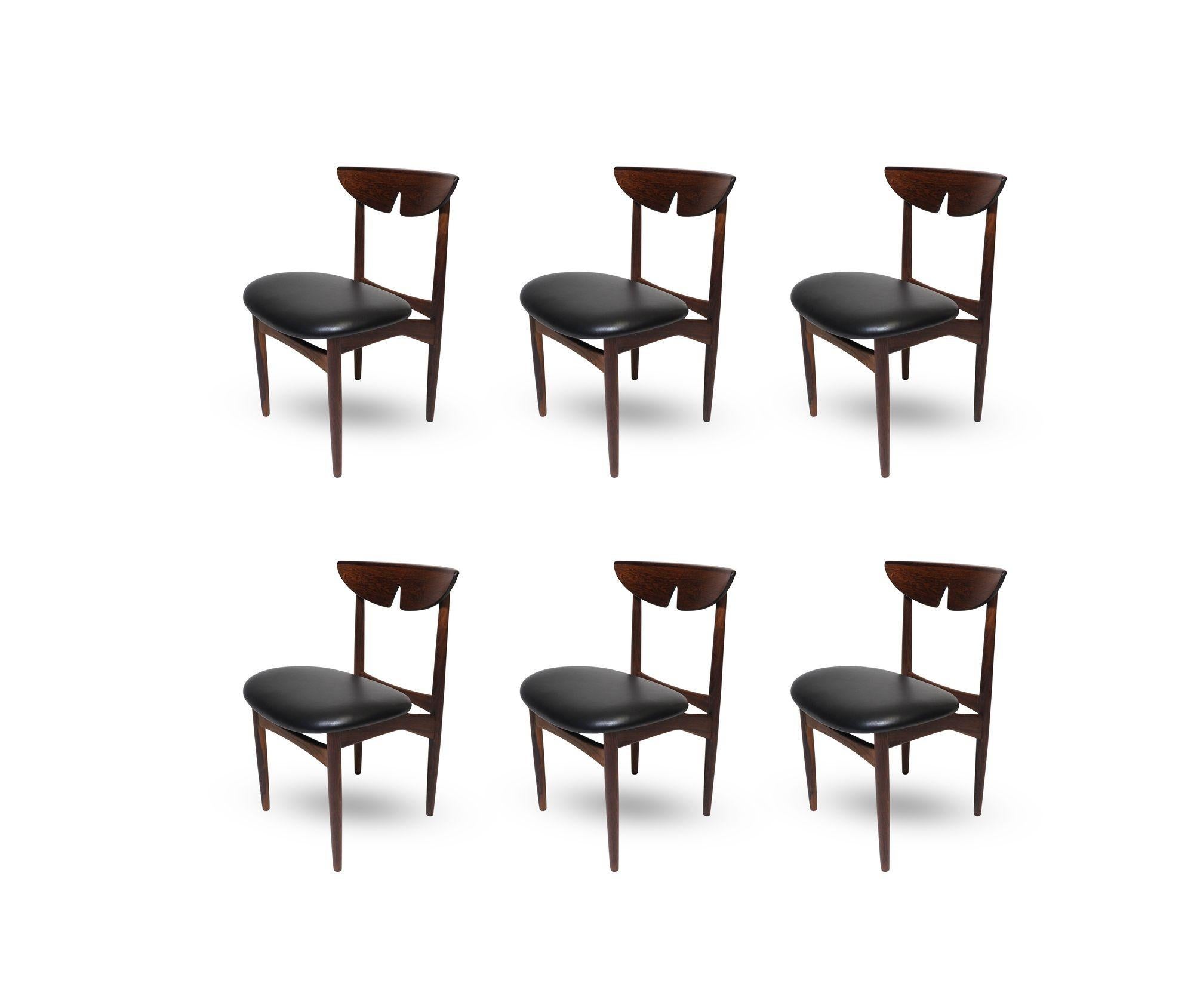 Elegant Midcentury Danish dining chairs designed by Kurt Ostervig for K.P Moblefabrik Denmark. The chair frames are handcrafted from solid Brazilian with sculpted butterfly backrests, and newly upholstered seats in a fine black leather. The finest