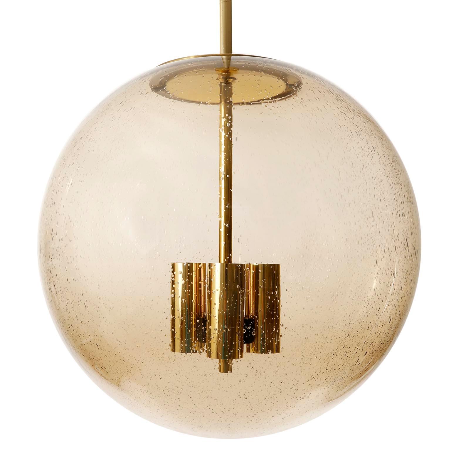 One of Six Large Limburg Globe Pendant Lights, Brass Amber Smoked Glass, 1970s In Good Condition For Sale In Hausmannstätten, AT