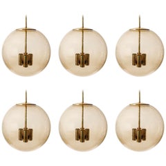 Six Large Limburg Globe Pendant Lights, Brass Amber Smoked Glass, 1970s