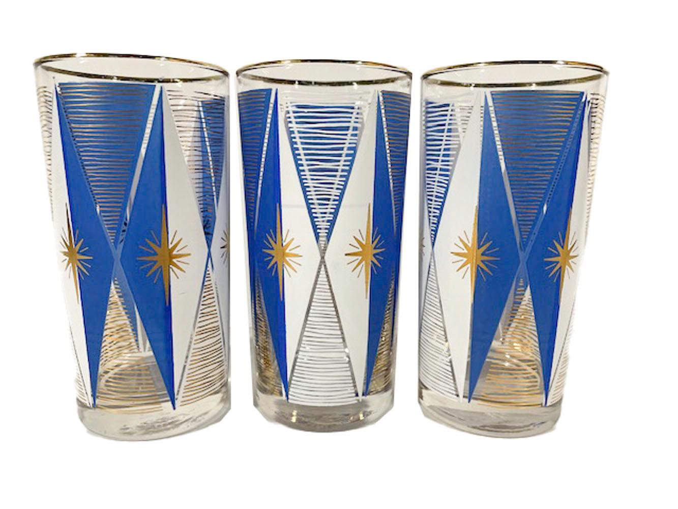 Six vintage highball glasses by Libbey in the Atomic taste having a gold starburst centered on an elongated diamond of blue and white enamel and with irregular horizontal gold lines in the space between the tops and bottoms ov the diamonds.