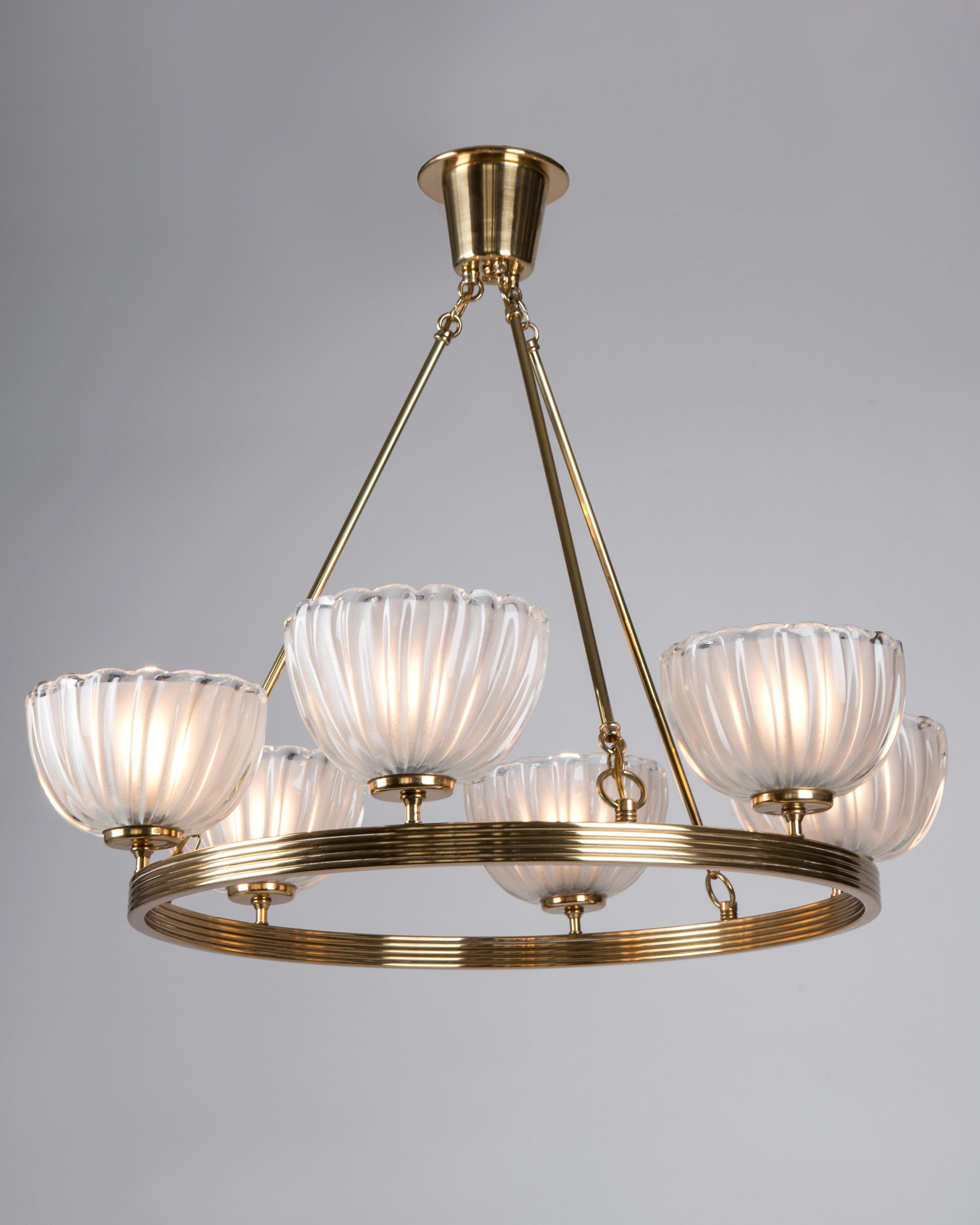 AHL4138
circa 1940
A six-light vintage chandelier comprised of clear glass shades set on a slender reeded hoop. The thick blown glass having deep ribs, each frosted on the interior. Attributed to the Venetian maker Barovier e Toso. Due to the