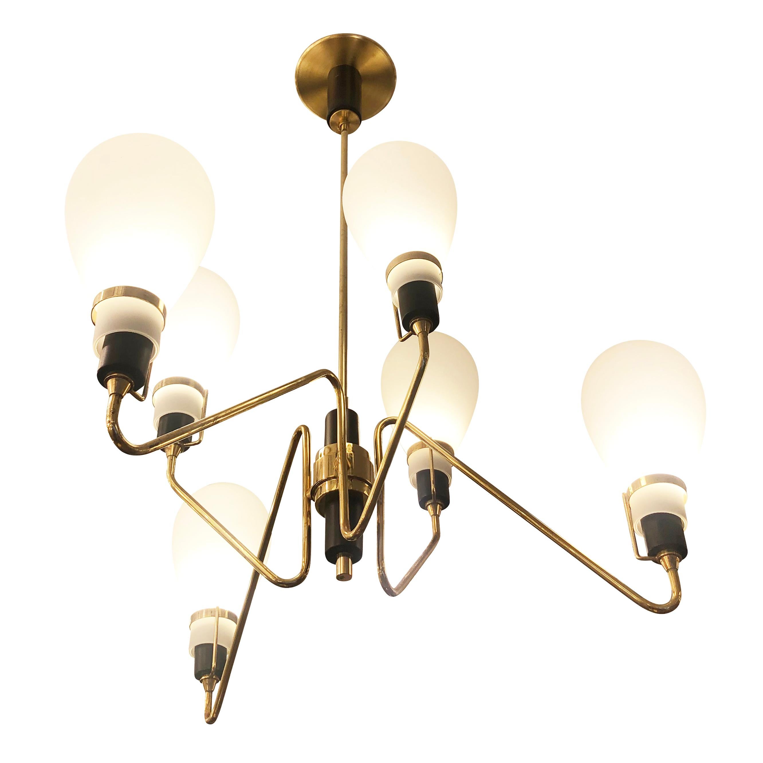 Italian midcentury chandelier with six staggered frosted glass shades on a brass and black lacquered frame. Holds six candelabra sockets. Height of stem can be adjusted as needed.

Condition: Excellent vintage condition, minor wear consistent with