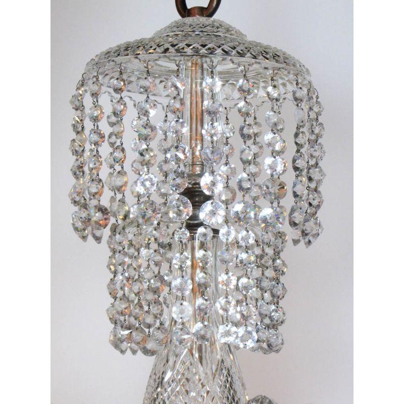 Six arm crystal chandelier. It was hanging in the dining room of a brownstone in Boston’s Back Bay for generations. A waterfall of crystal chains flows from the top two tiers, Roped Canes with unusual large crystal drops, Diamond cut pattern on
