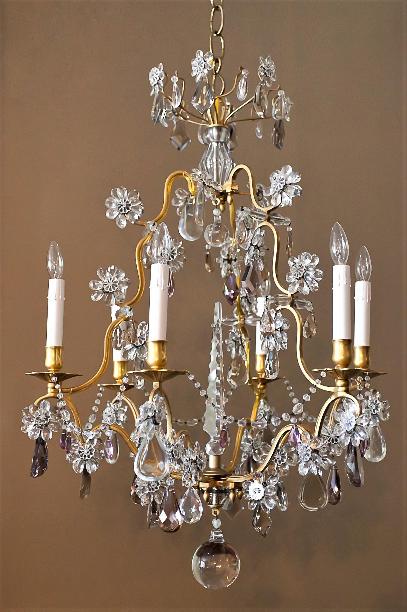 Hand wrought gilt bronze frame with handcut clear, light-amethyst and smokey-quartz prisms. The fixture has crystal chain, central cut spire, and blossoms. Chandelier comes with hanging hardware, ceiling cap, and one foot of chain.