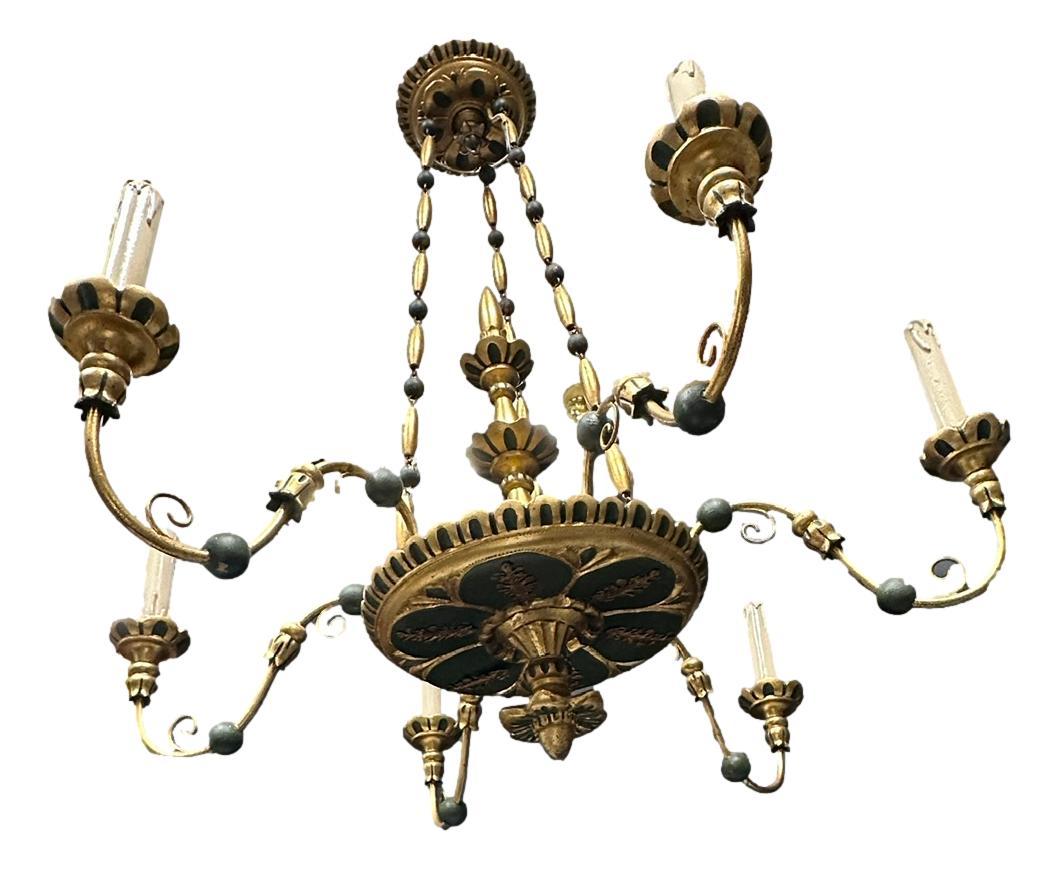 Add a touch of opulence to your home with this charming chandelier! Perfect green colored, gilt wood and hand carved chandelier to enhance any chic or eclectic home. We'd love to see it hanging at a dinning place as a charming welcome. The chain