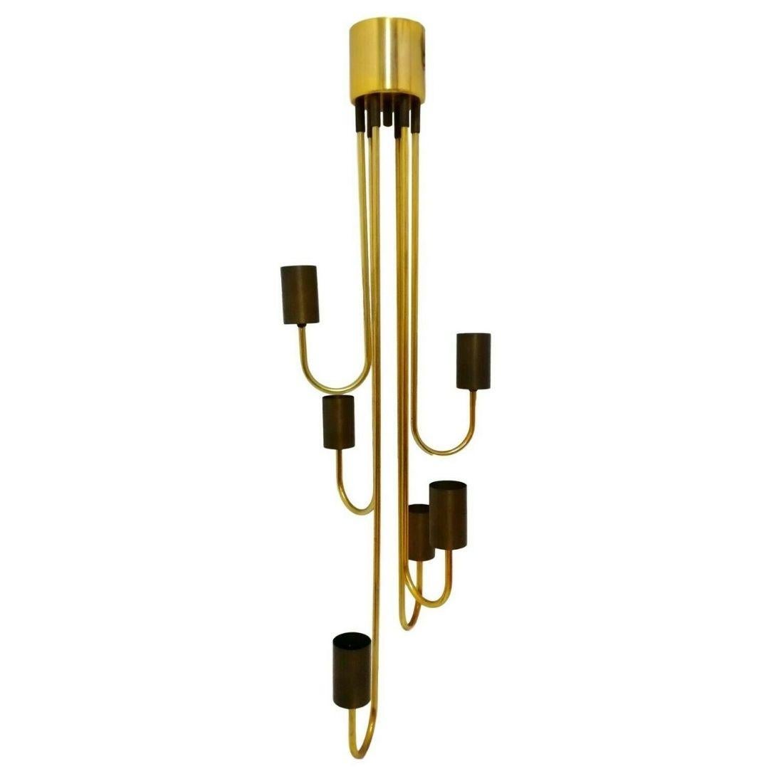 splendid six-light chandelier, Goffredo Reggiani production from the 1970s

entirely made of brass, with six curved arms and lamp holder facing the ceiling, extreme elegance and sobriety

It measures about 1 meter in height, in excellent storage