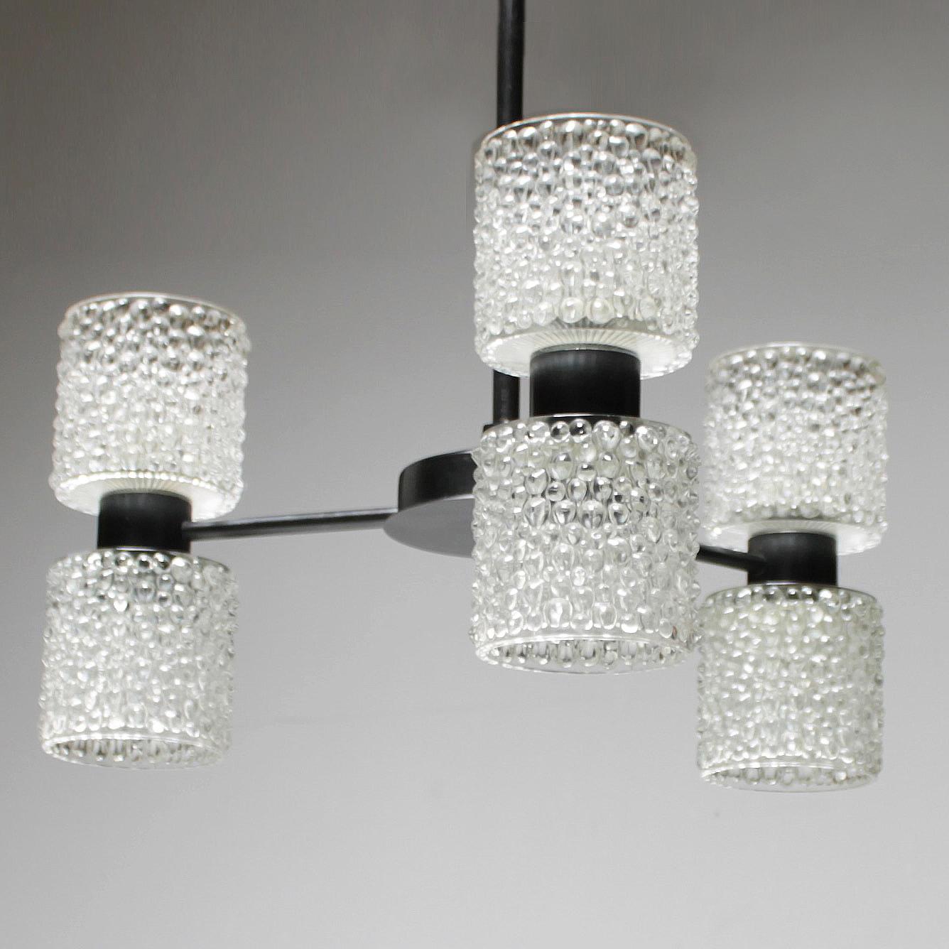 Six-light chandelier 'Zonnewende' by RAAK Amsterdam, design J.W. Bosman, 1965. All lamps are fitted with heavy crystal shades, which radiate in a glittering way. Because of this quality the chandeliers were dubbed 'Solstice' in the RAAK sales