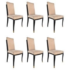 Seis sillas de comedor Maison Jansen de laca negra y latón