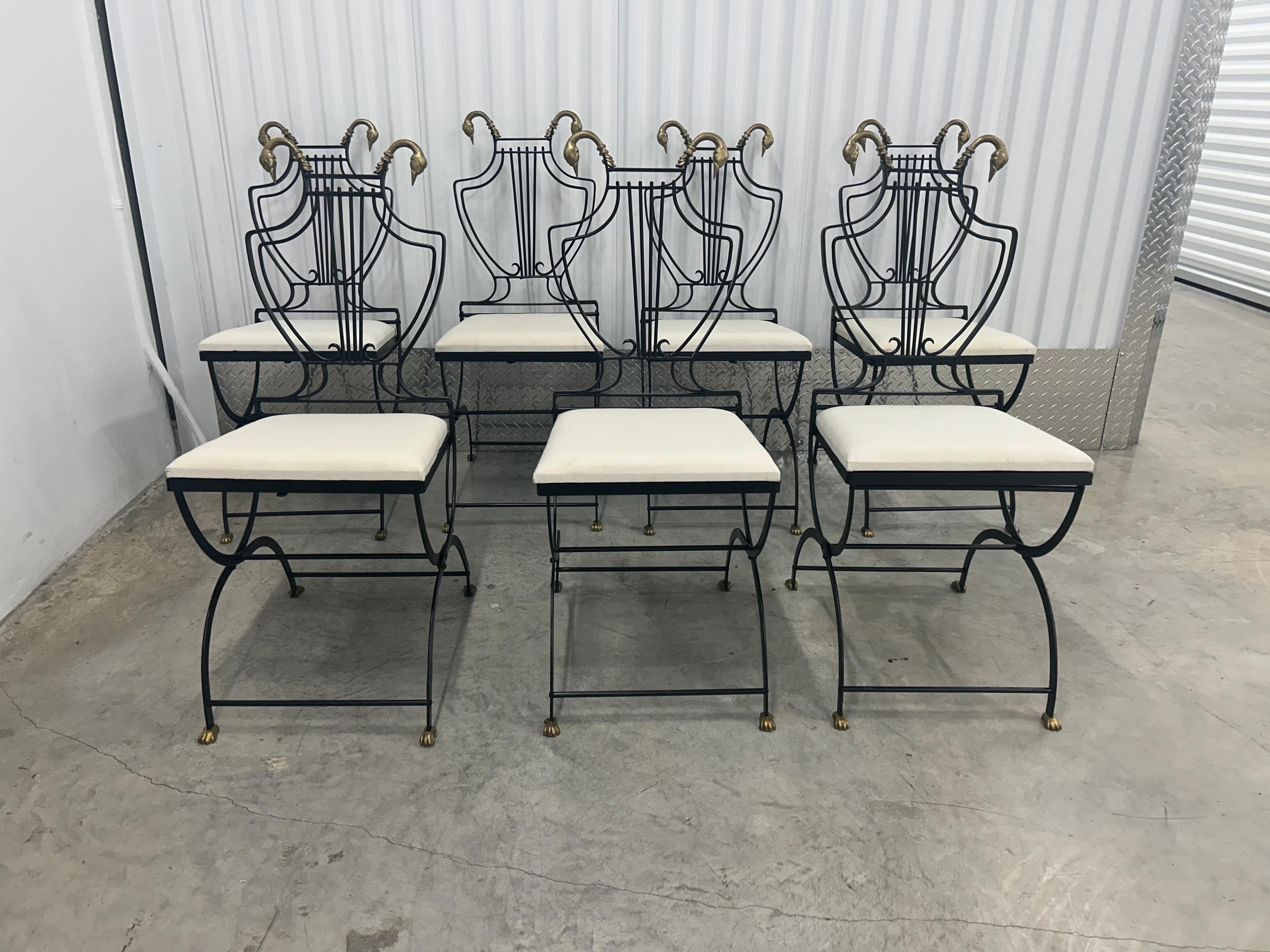 A completely restored set of six  lyre  back chairs with brass swan, heads and brass paw  feet… the chairs also fold… the chairs can be used as dining chairs and also used outside… The seats are brand new and covered in muslin..