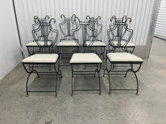 Six Lyre back chairs with brass swan heads and paw feet