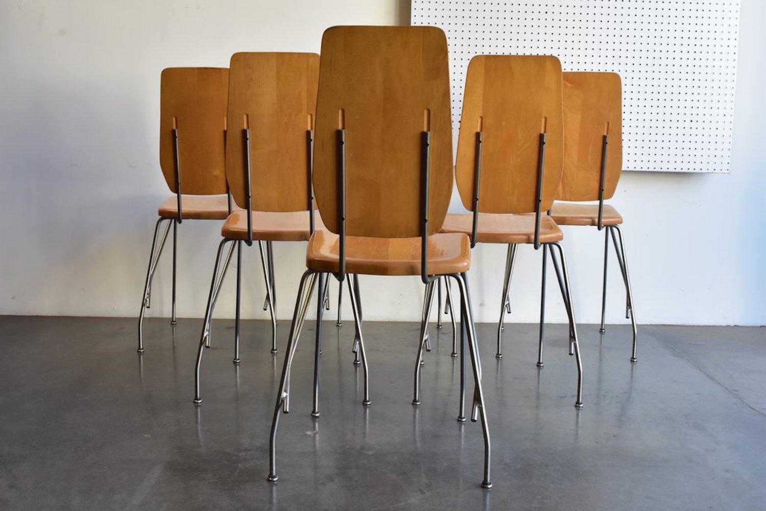 Six dining chairs by Robert Josten, circa 1970s. Aluminum legs and base with maple back rest and seat. Each chair measures 14.5