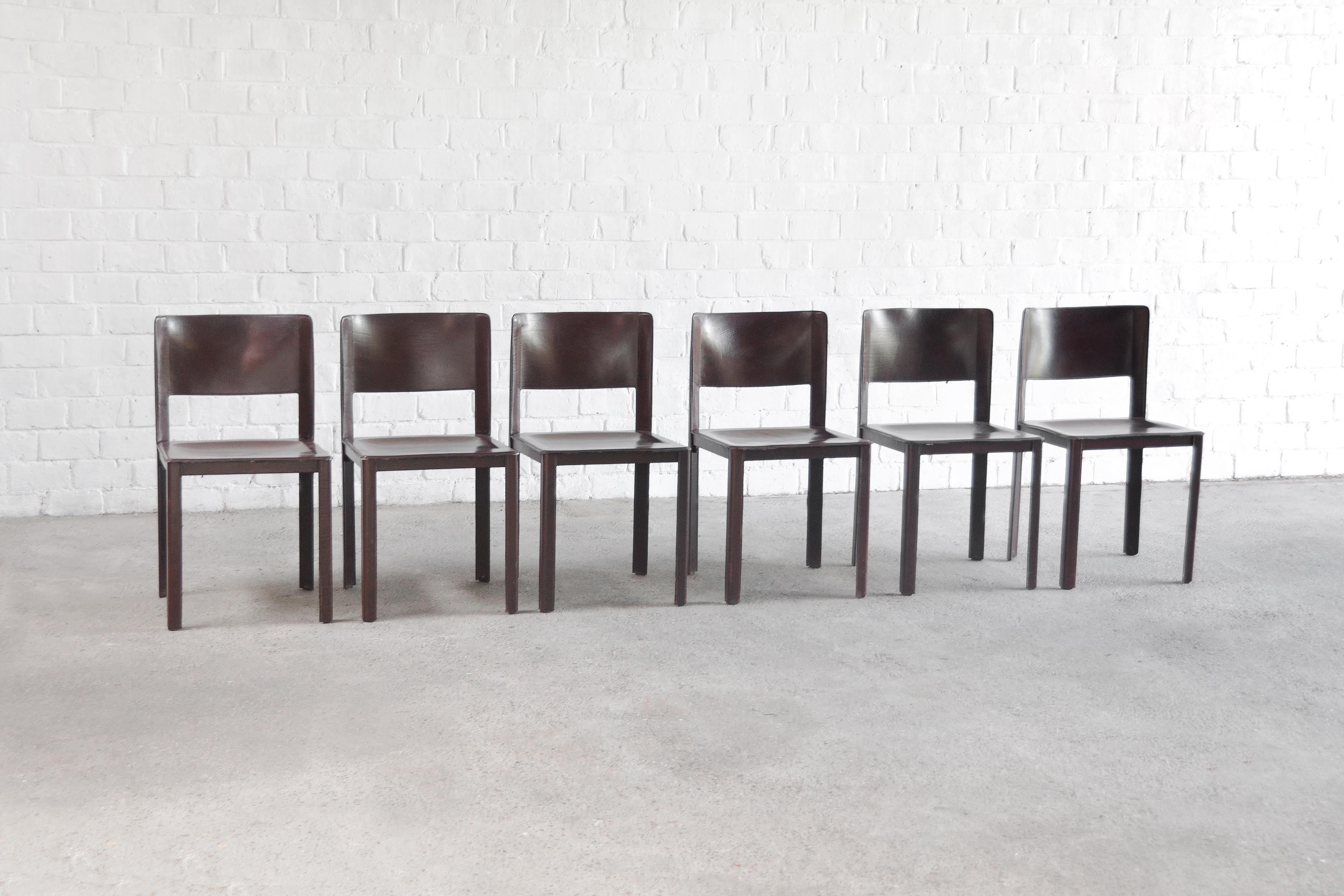 A set of six sophisticated 'Coral' dining chairs by Matteo Grassi, made in Italy late 70's or early 80's. These chairs show a high level of manufacturing with a very sturdy structure and quality thick stiched leather. The leather has an elegant and