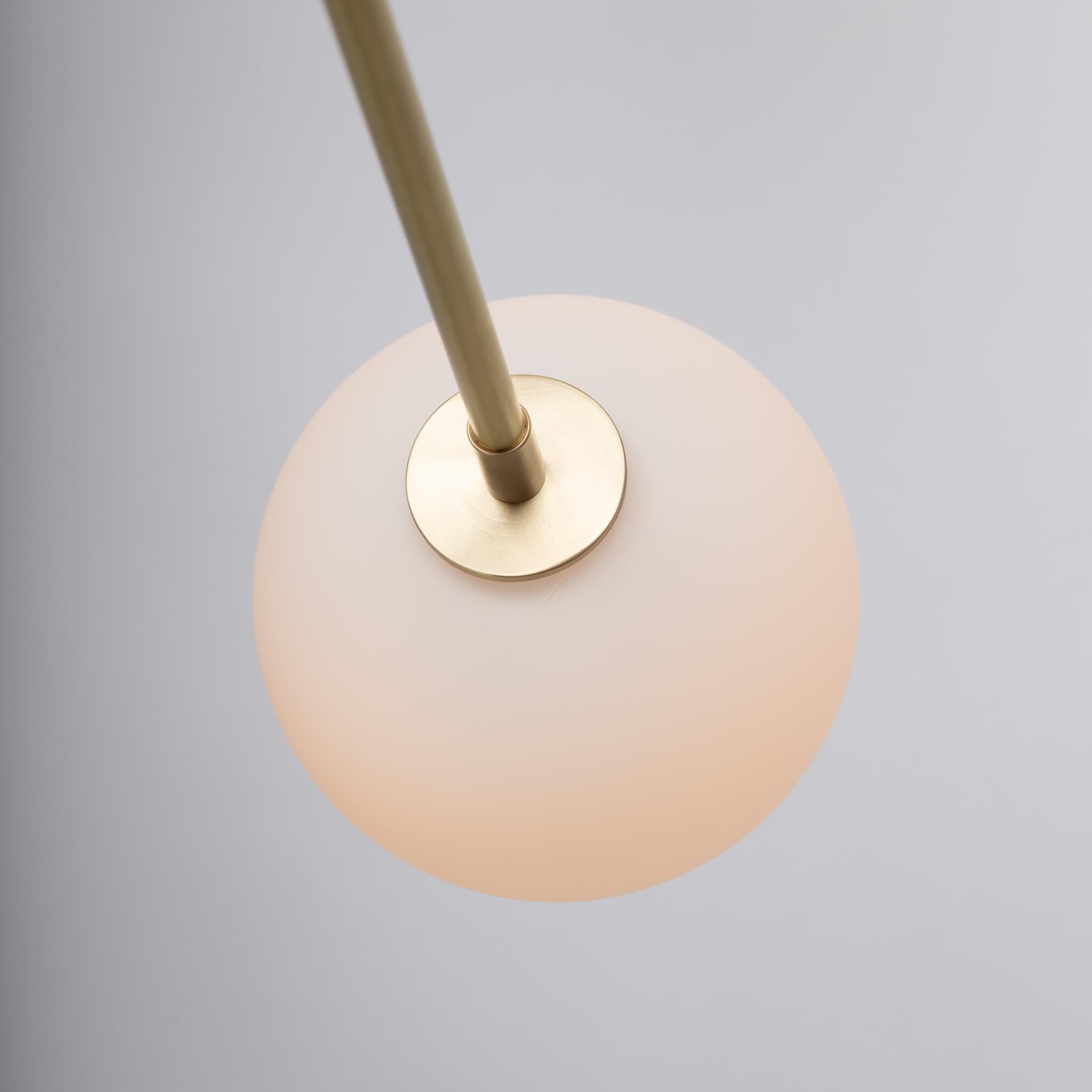Contemporary Six Matte Sphere Articulating Satin Brass Pendant For Sale