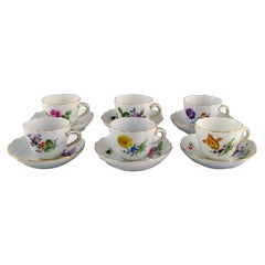Six Meissen coffee cups with saucers in hand-painted porcelain.