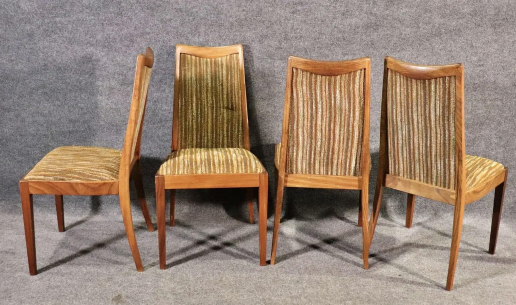 Set of six mid-century modern dining chairs made by G-Plan Furniture from the UK. Teak wood frames with original upholstered seats and backs. 
Two armchairs: 36