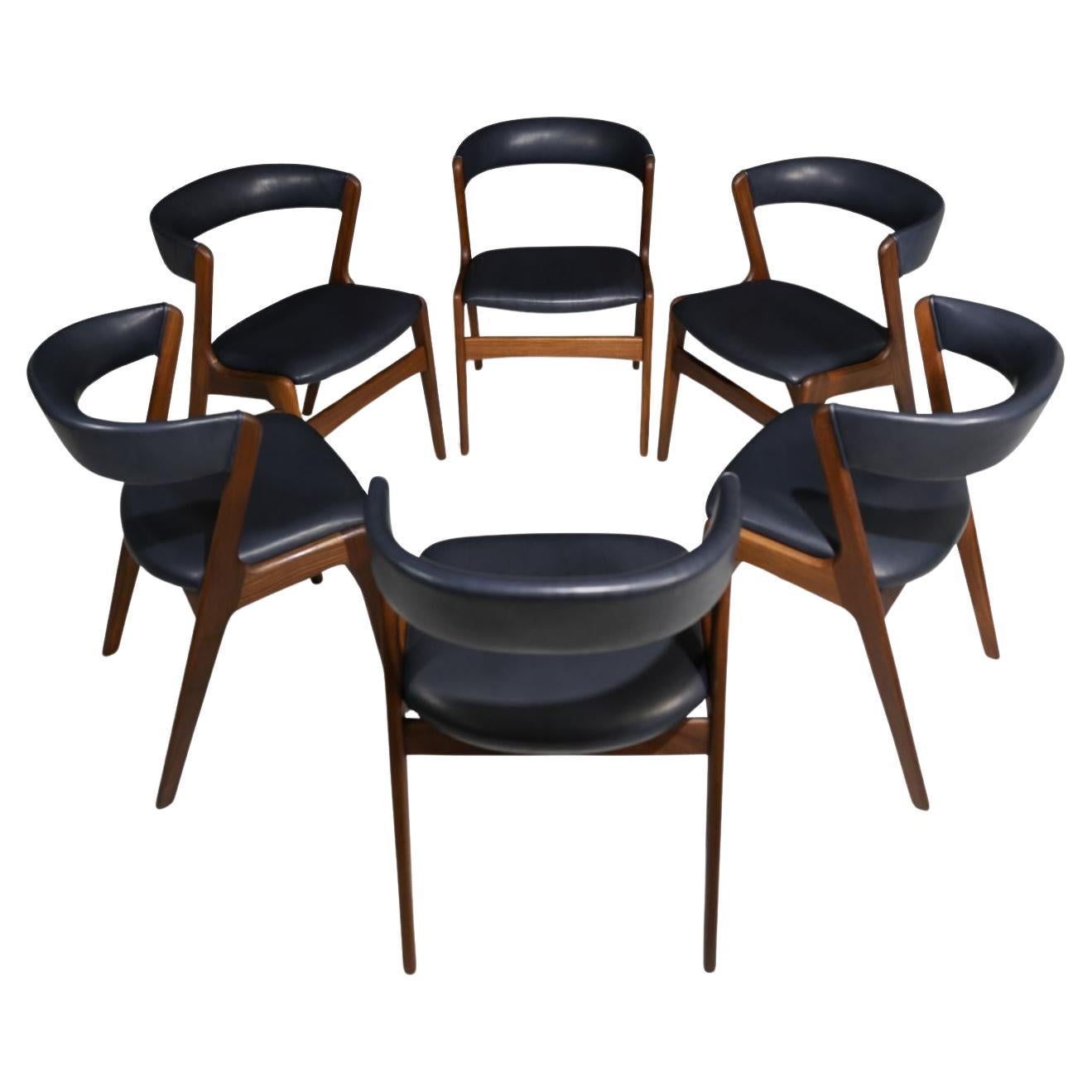 Six Mid-century Curved Back Dining Chairs in Navy Leather
