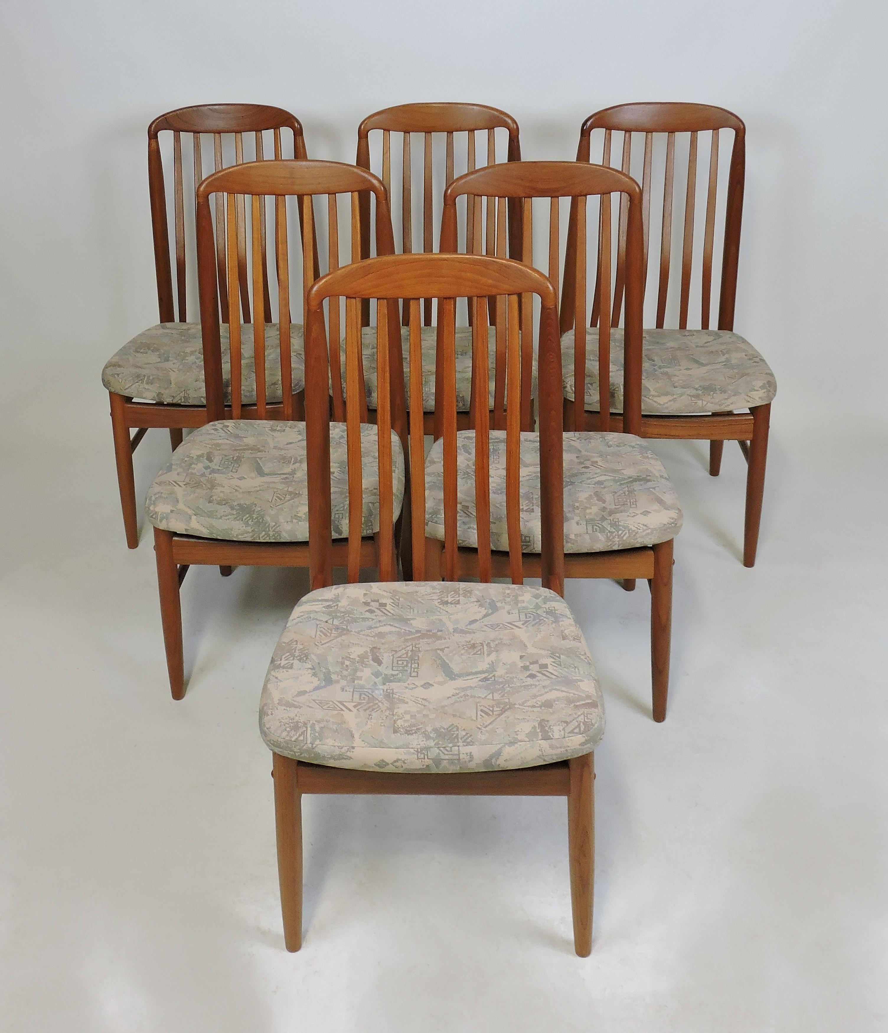 Set of six BL10 Sanne dining chairs designed by Danish designer Benny Linden. These chairs are made of solid teak with contoured spindle backs and upholstered seats. Very comfortable chairs with a graceful look. 

Please note: we are having these