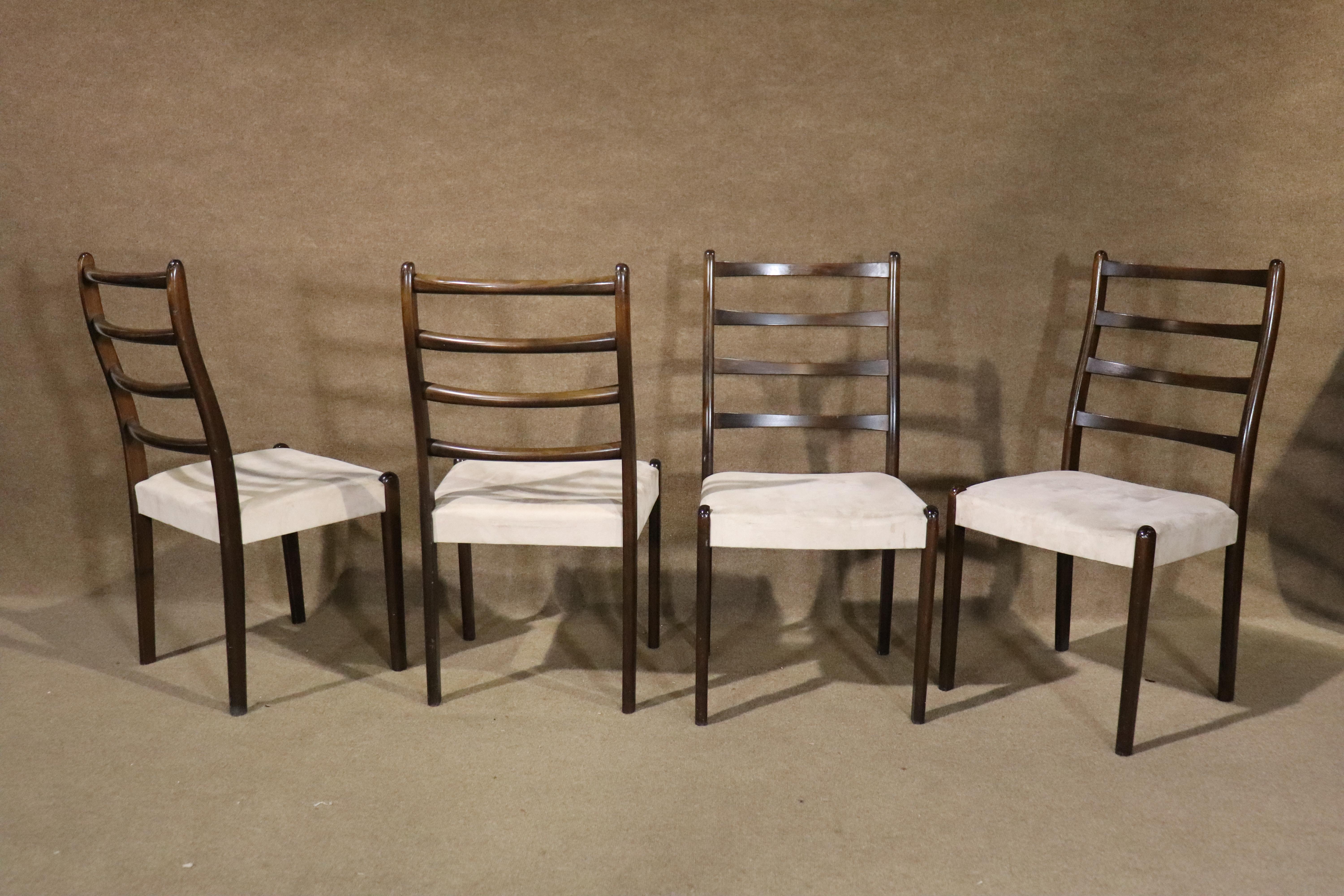 Set of six mid-century modern dining chairs with sculpted ladder backs. Great form for comfort with thick cushioned seats.
Please confirm location NY or NJ