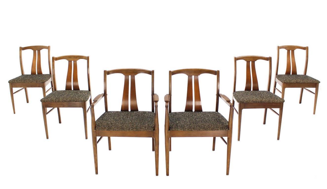 Set of six Mid-Century Modern dining chairs with curved backs and new upholstery.