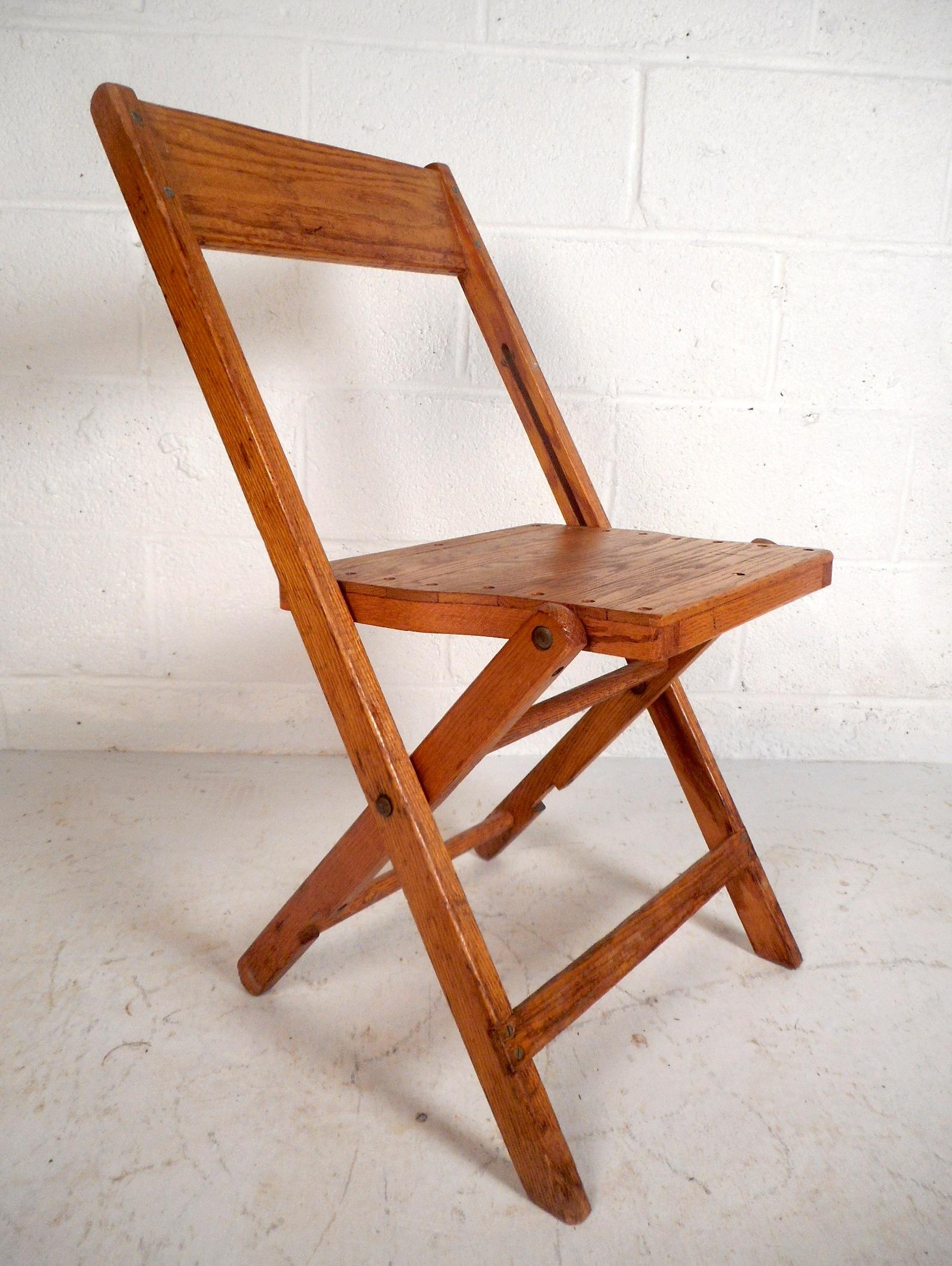 These midcentury folding chairs are perfect for any conference or social gathering. They are quite stylish with their vintage oak finish and slatted seats. The six folding chairs were made in America by Snyder Chair Co. and are very sturdy as a