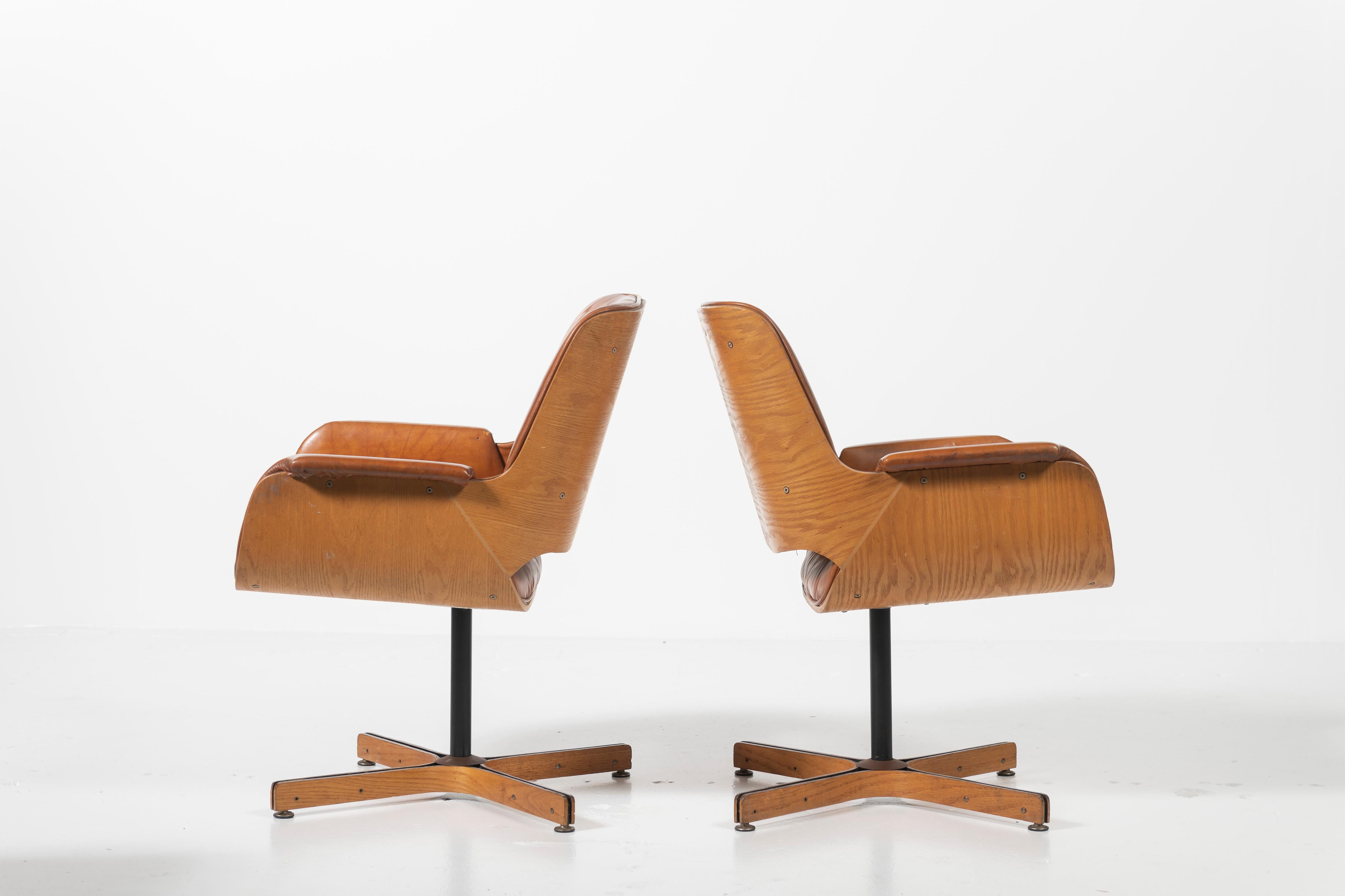 Pair of Mid-Century Modern Swivel Faux Leather and Wood Armchairs by Plycraft 2