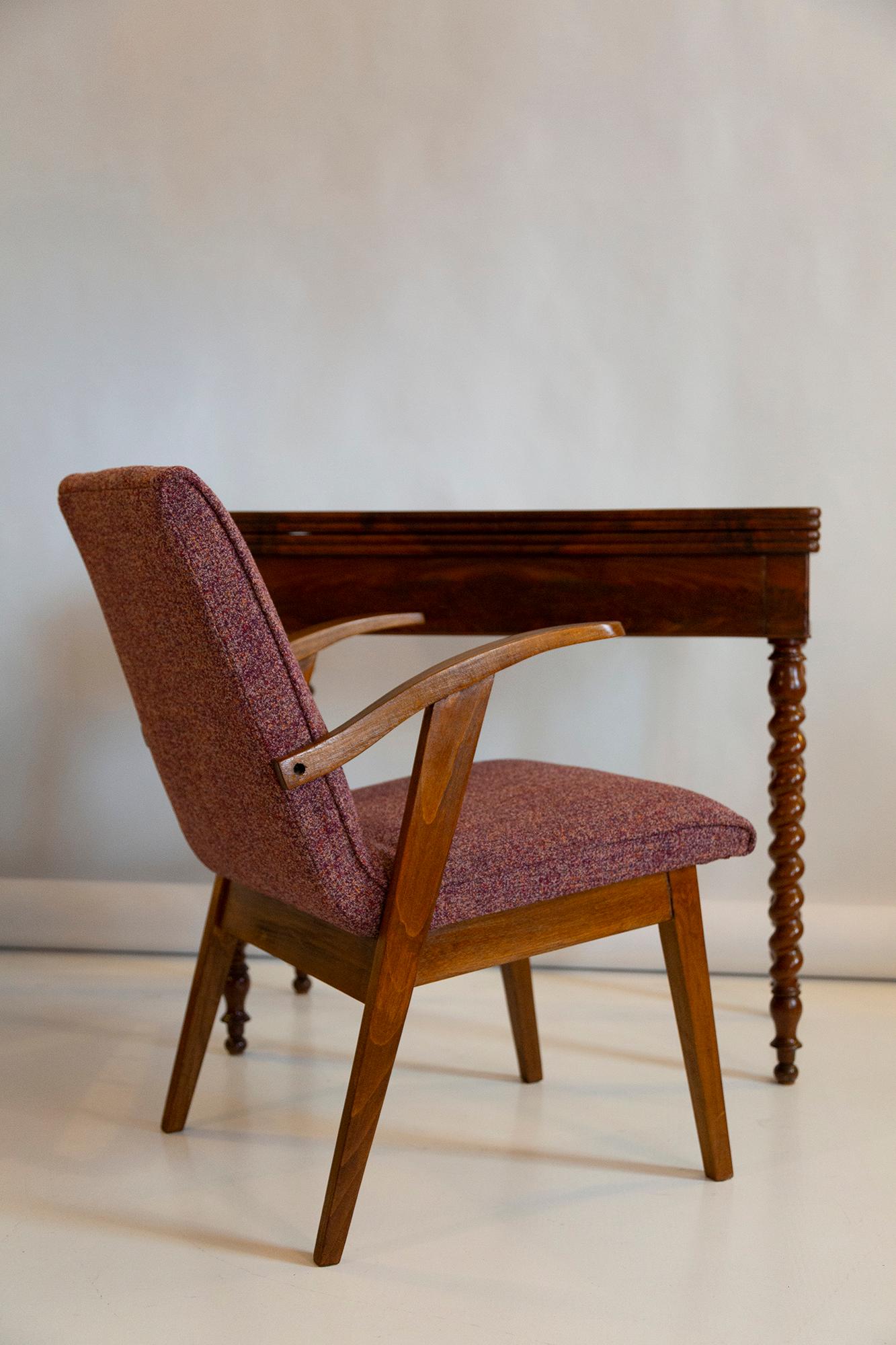 Armchair designed by Mieczyslaw Puchala. Dark brown wood combined with a purple melange beautiful fabric gives it elegance and nobility. The chair has undergone a full carpentry and upholstery renovation. The wood is in excellent condition after