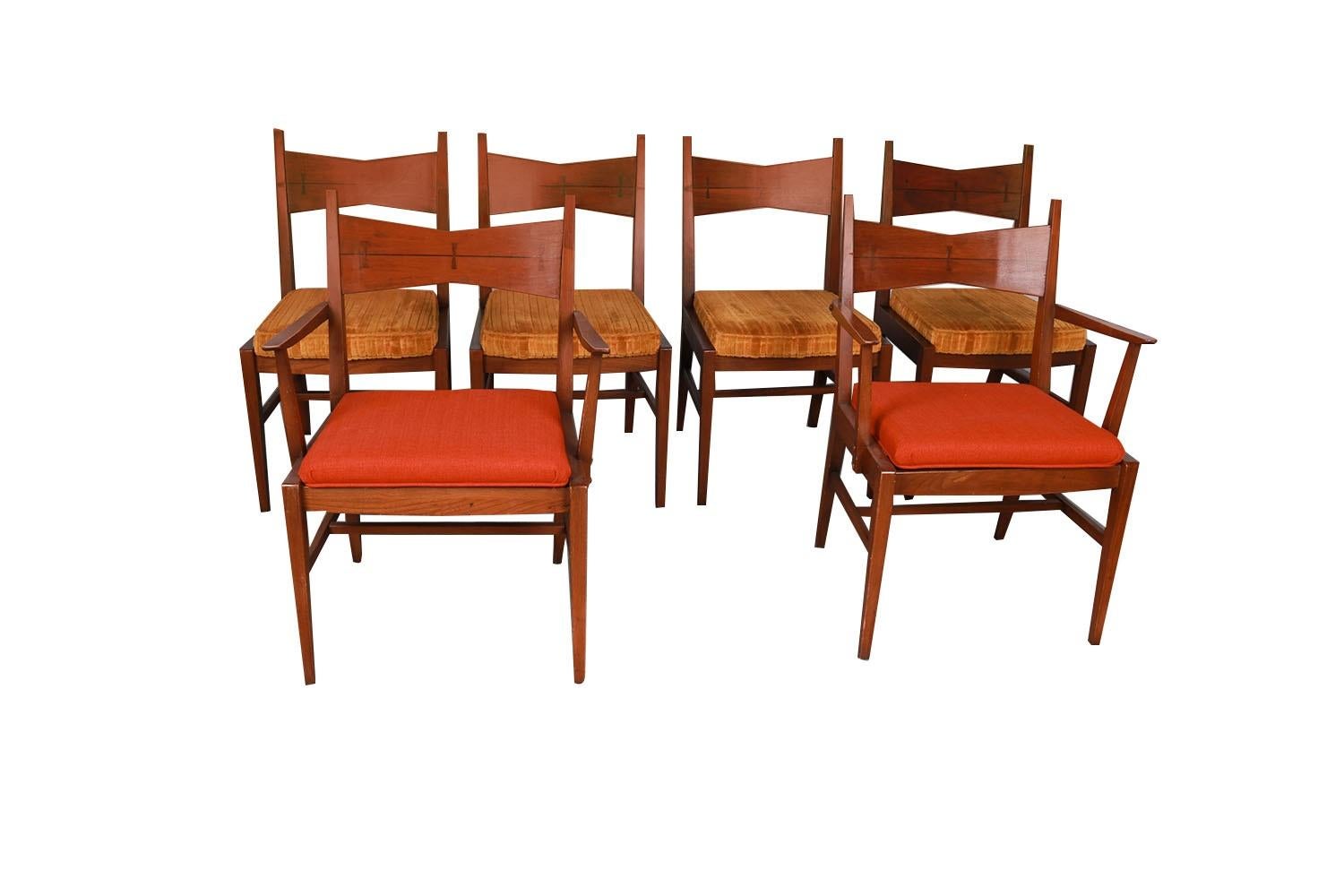 Set of six stunning Mid-Century Modern Walnut Bow Tie Tuxedo dining chairs in great original condition, from Lane Tuxedo line manufactured by Lane, in the style of Paul McCobb. Features two captain armchairs in new upholstery and four side chairs in