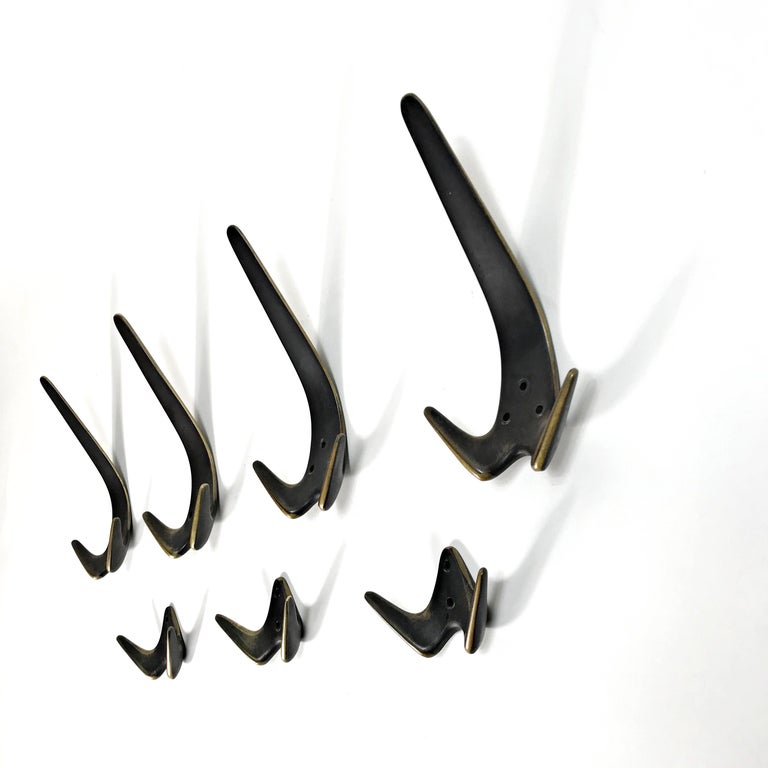Patinated Six Midcentury Carl Auböck Polished Brass Wall Coat Hooks, 1950s, Austria For Sale