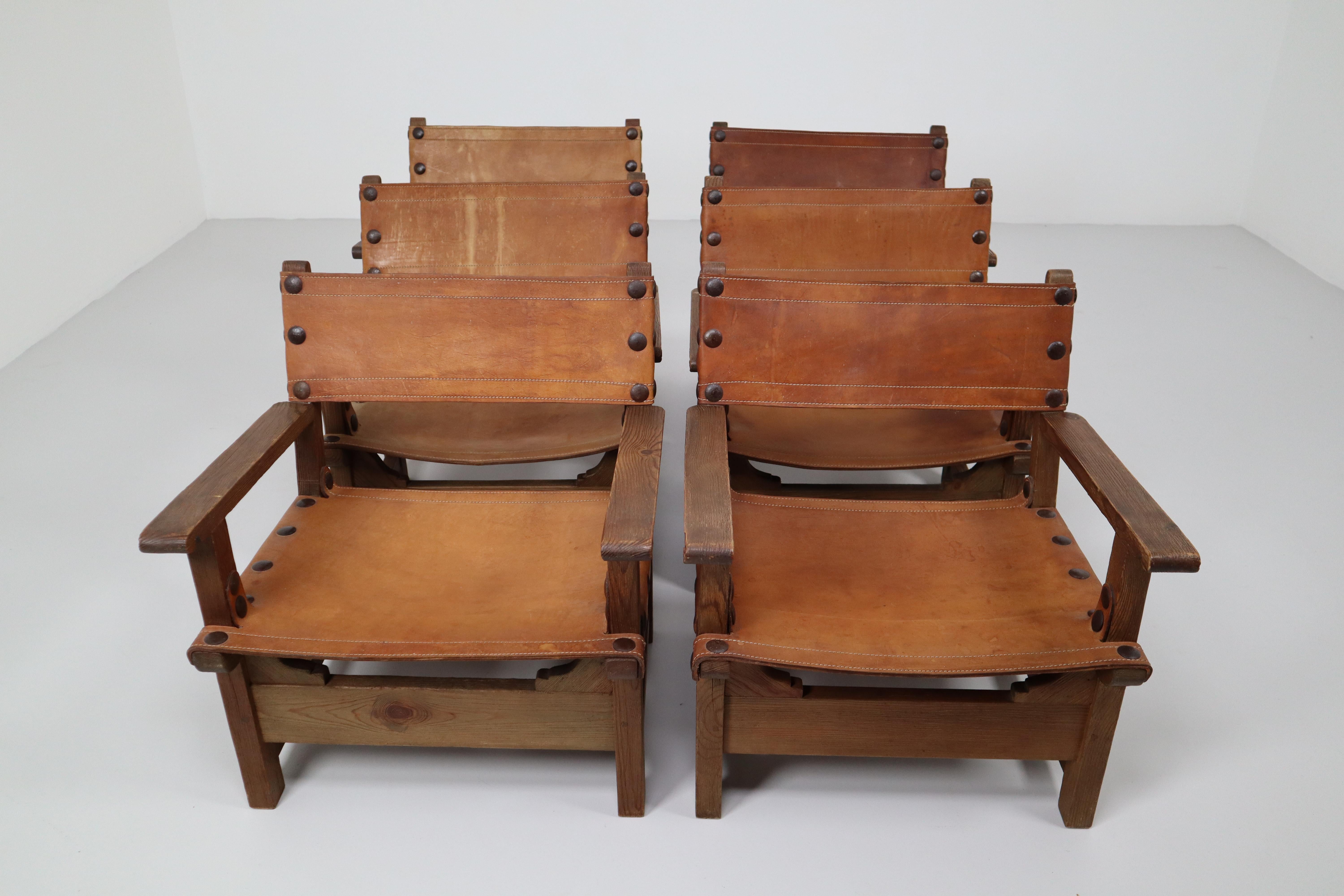Six Midcentury French Lounge Chairs in Patinated Cognac Saddle Leather, 1950s (Französische Provence)