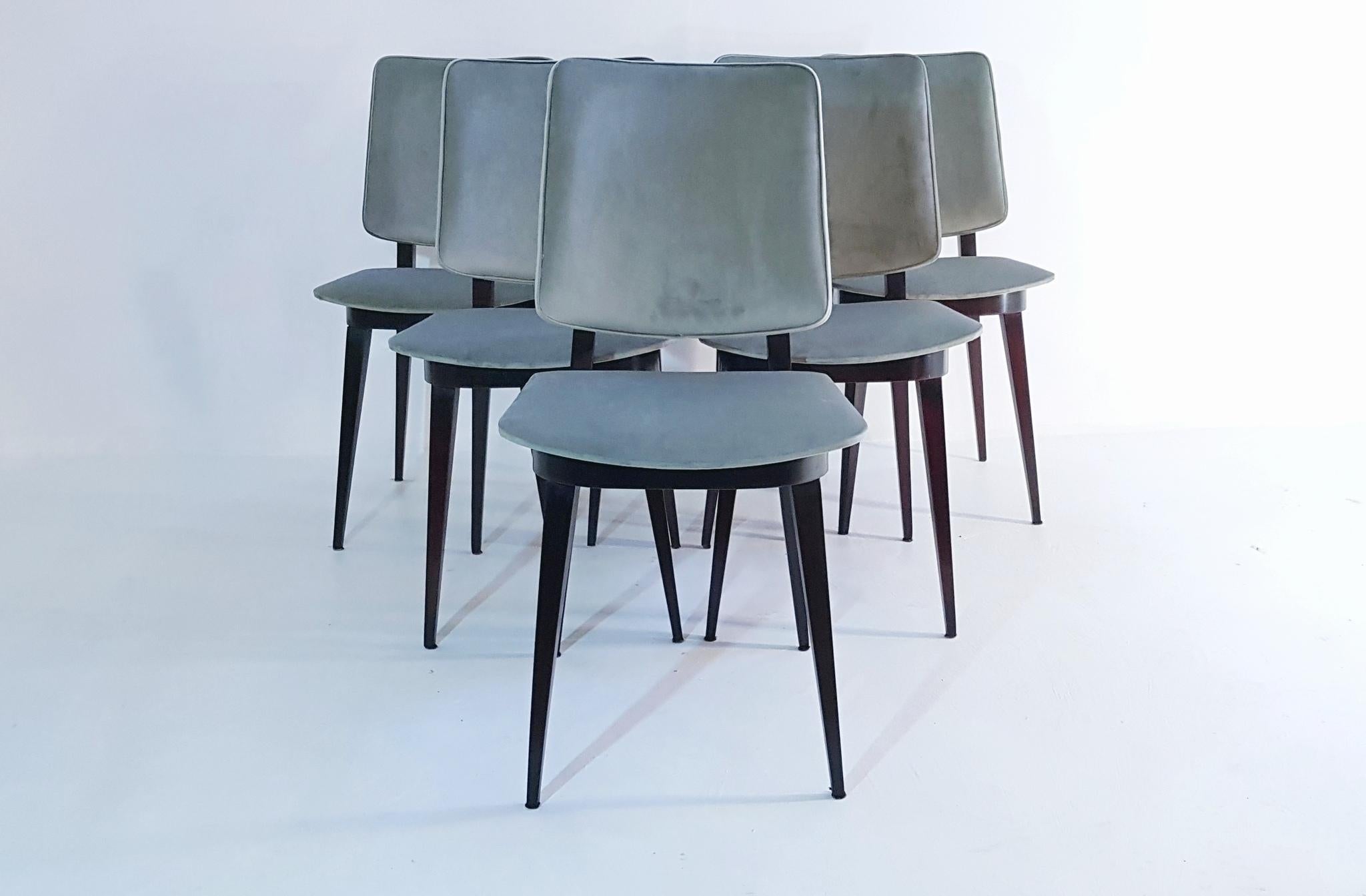 A set of six dining chairs in stained ebony colored wood. With seats and backrests covered in a brand new pastel /jade green velvet which is very durable and easy to clean from stains. A very clean design without any extra fuss or decor.

These
