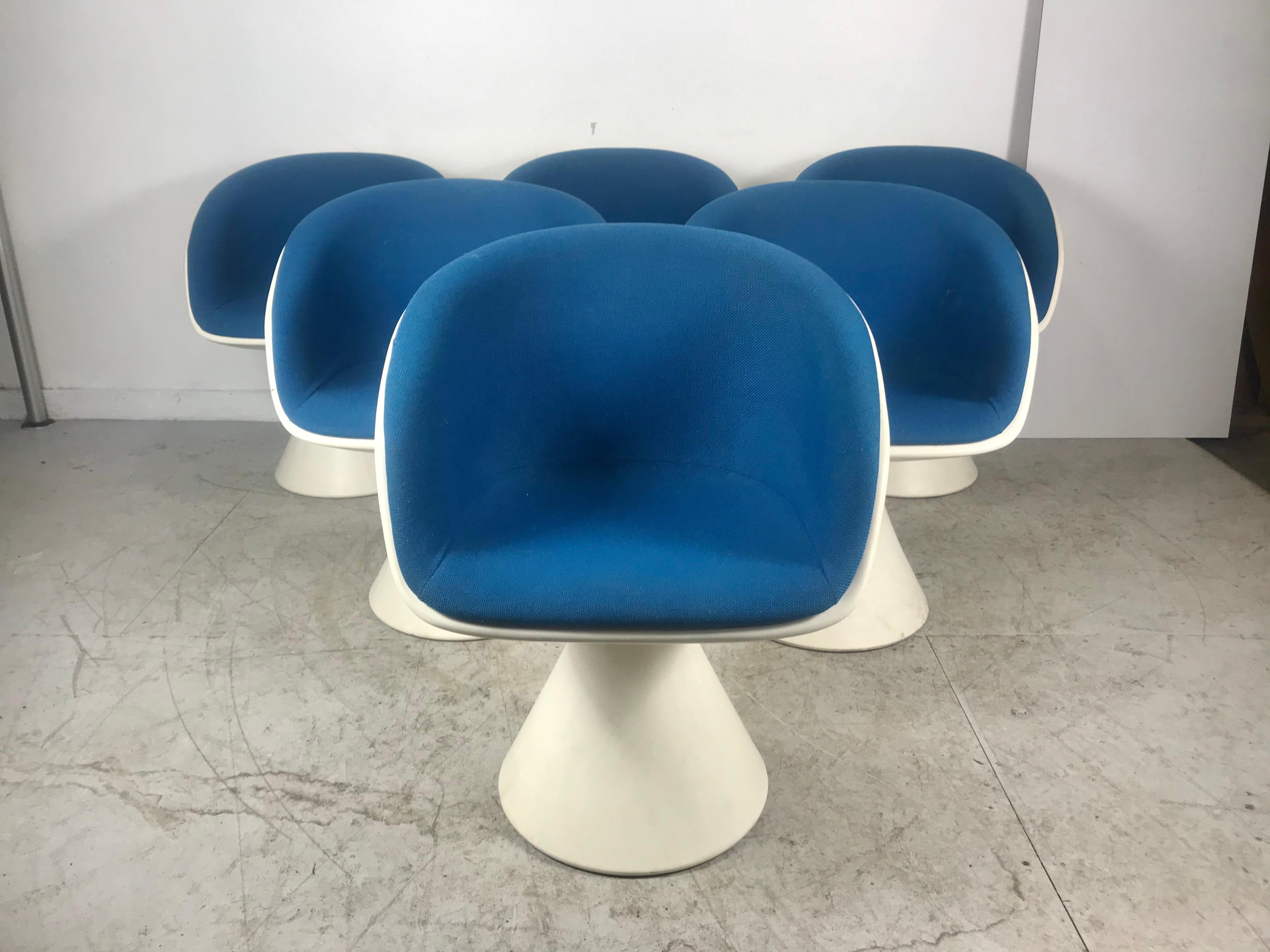 Modernist, Space Age dining set consisting of six swivel tulip armchairs designed by Maurice Burke in 1966 for Arkana, Bath, UK. Classic 1960s design. Retain original blue wool (Herman Miller), Girard fabric. In nice original condition, extremely