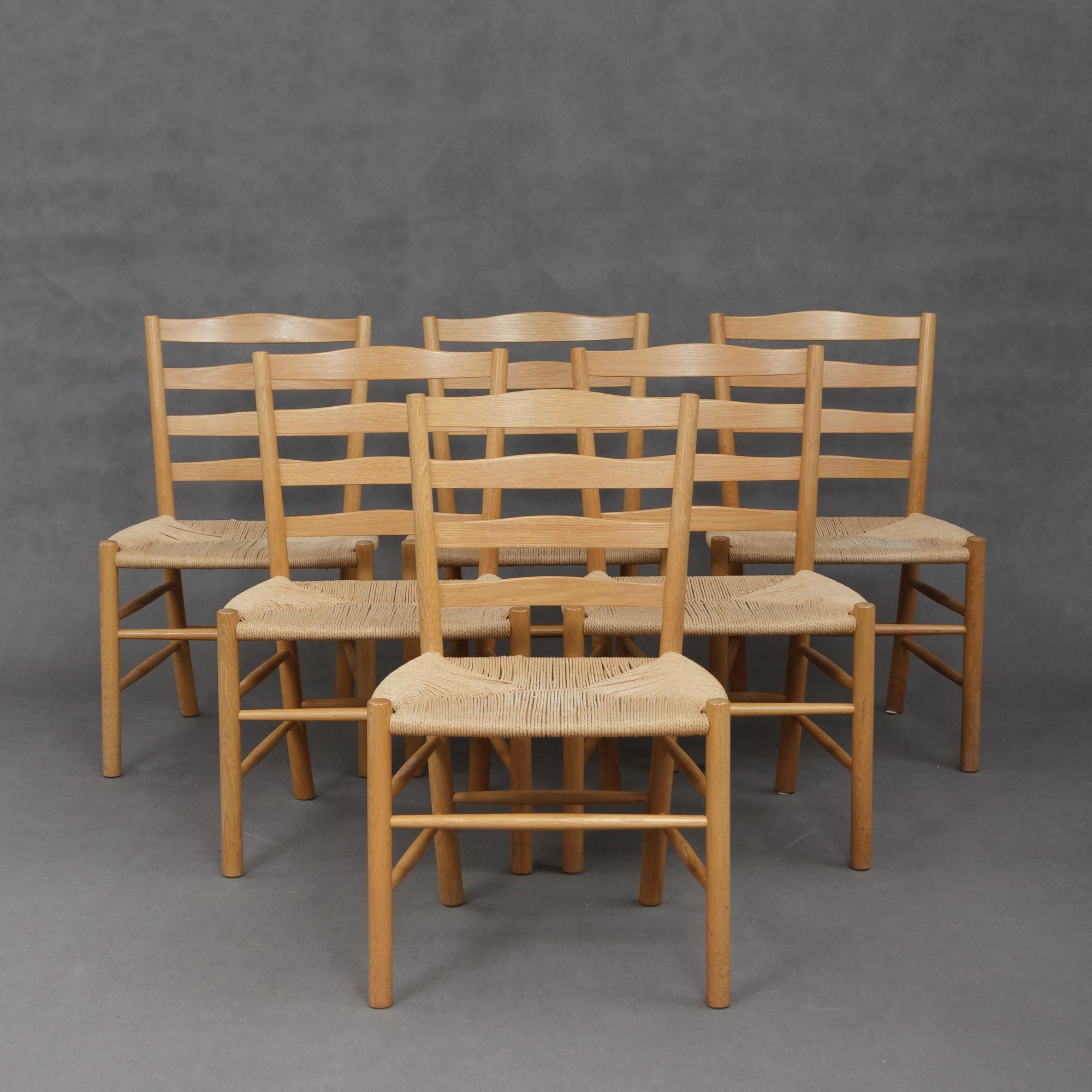 Designed in the 1950s these Classic Danish chairs feature solid light oak structure and paper cord seats. This particular set was manufactured in 1984. Good condition with no loose joints and above all not damaged or stretched seats. Fritz Hansen