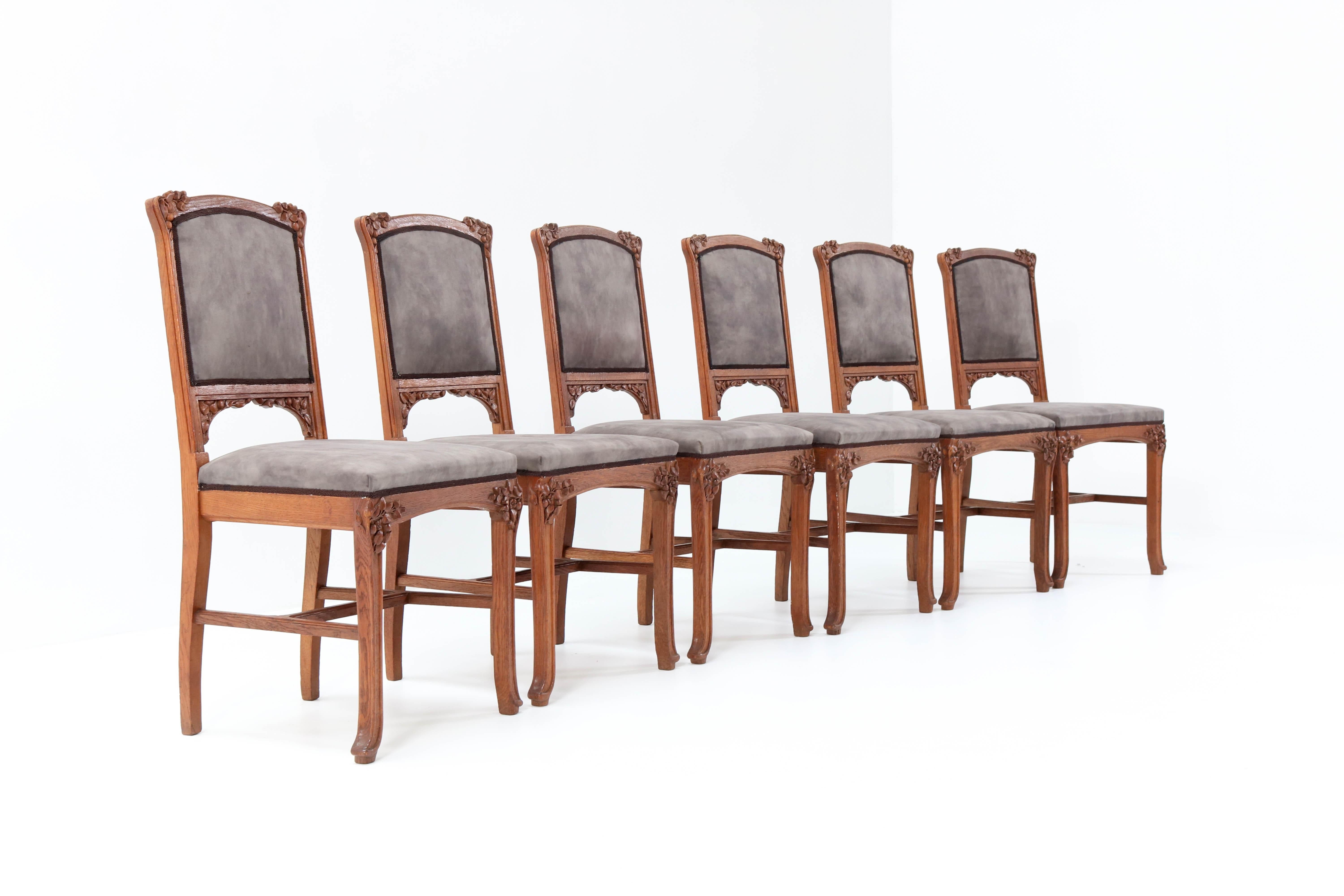 Magnificent and rare set of six Art Nouveau chairs.
Design attributed to Jacques Gruber.
Striking French design from the 1900s.
Solid oak with wonderful hand carved details.
Re-upholstered with a quality taupe Italian fabric.
In very good