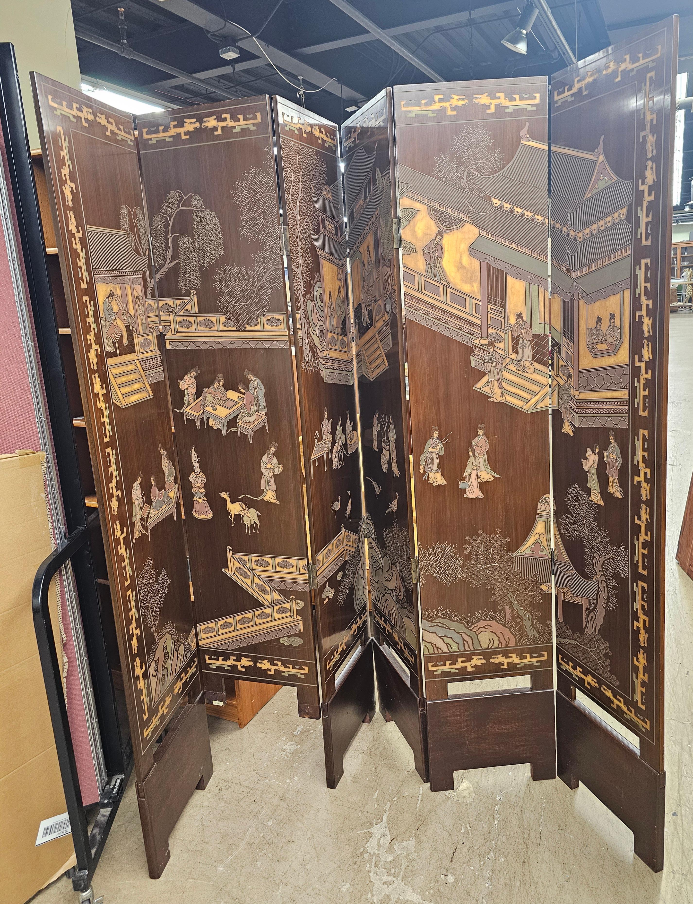 Six-panel double sided Coromandel Asian Screen on stand. Each panel seats in a removable custom wood stand / shoe.  Brownish gold color on one side and nature on the other. The subject matter on the gold side are multi scenes of men and women 