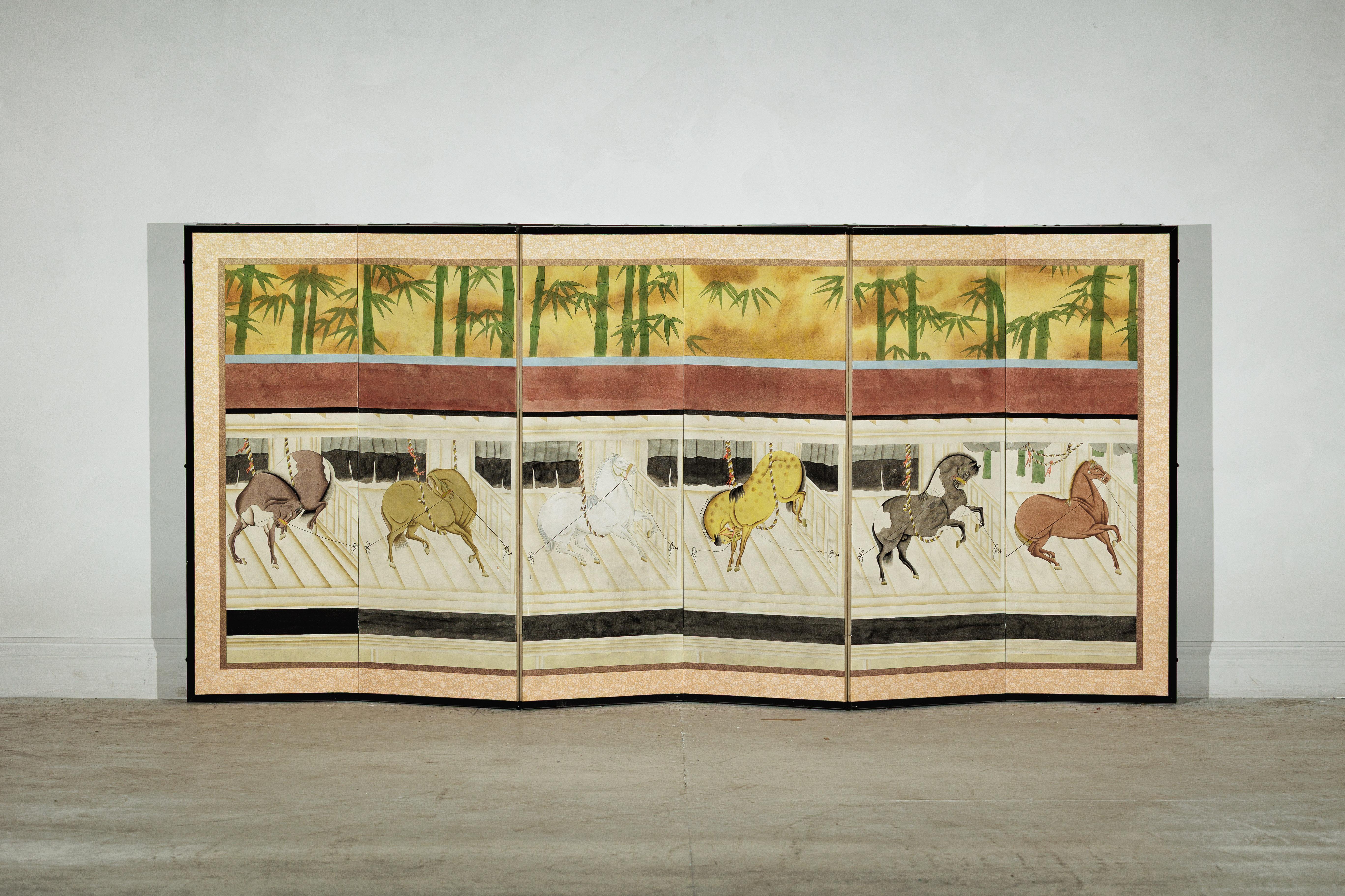 This striking six-panel Chinese folding screen showcases a vibrant painted scene of six individually depicted horses, each rendered in expressive motion within their stables. Likely inspired by Japanese screen compositions but executed in China