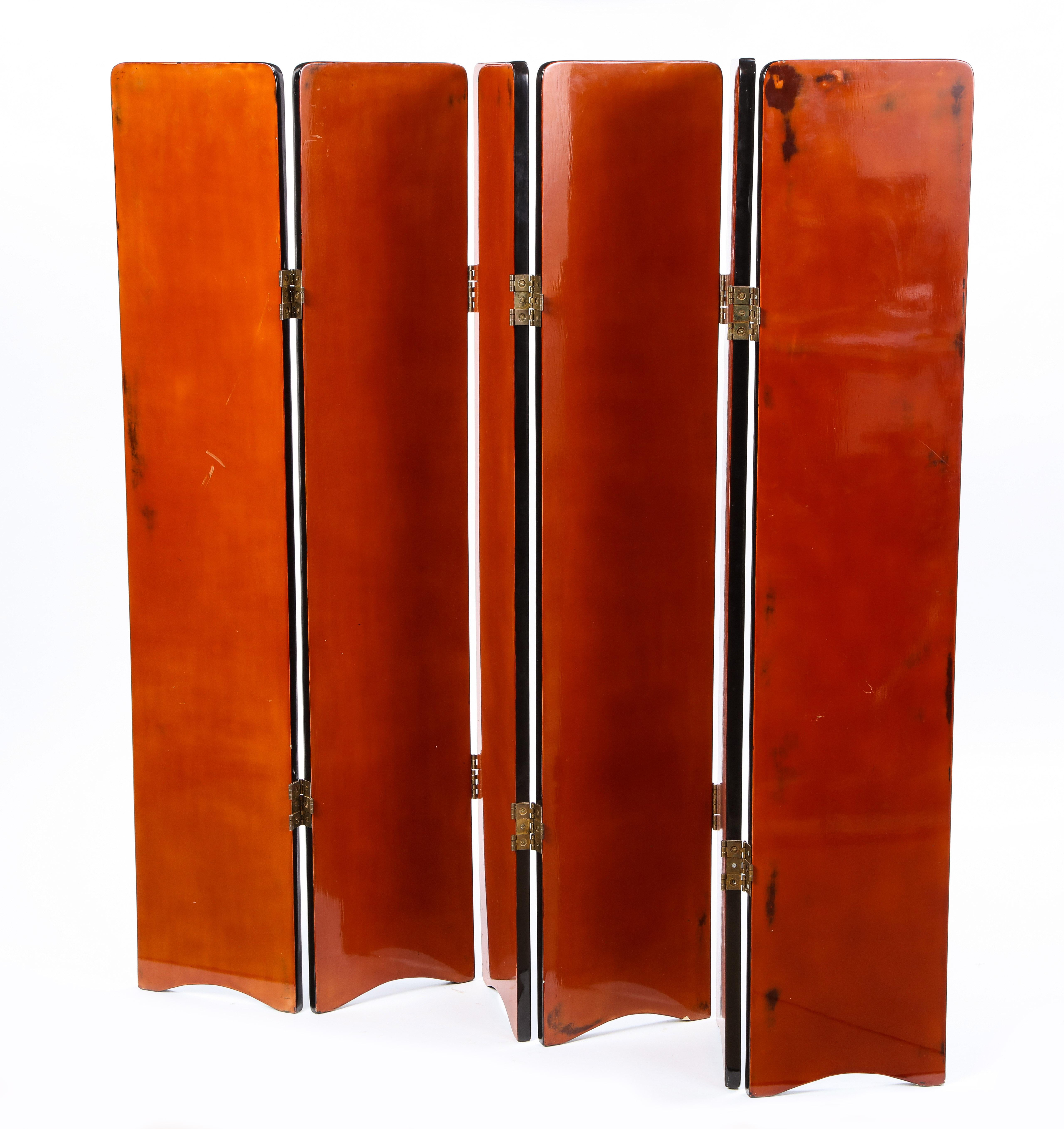 This vibrant red and black lacquered modern screen serves a multi-functional need for any home. Whether decorative or functional, this six-paneled screen with gold-tone metal hinges is an ideal room divider for a Manhattan apartment or dressing