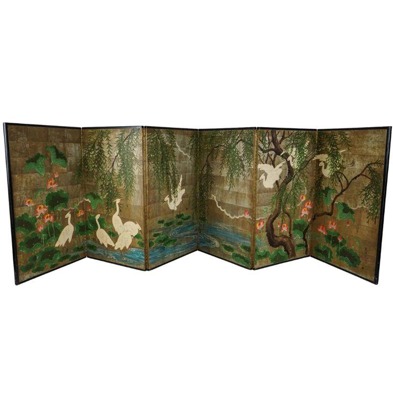A six panel, signed Robert Crowder, gold leaf landscape screen. This chinoiserie style screen showcases a breathtaking scene of serene beauty and delicate elegance. The panels are adorned with opulent gold leaf, imparting a luxurious and timeless