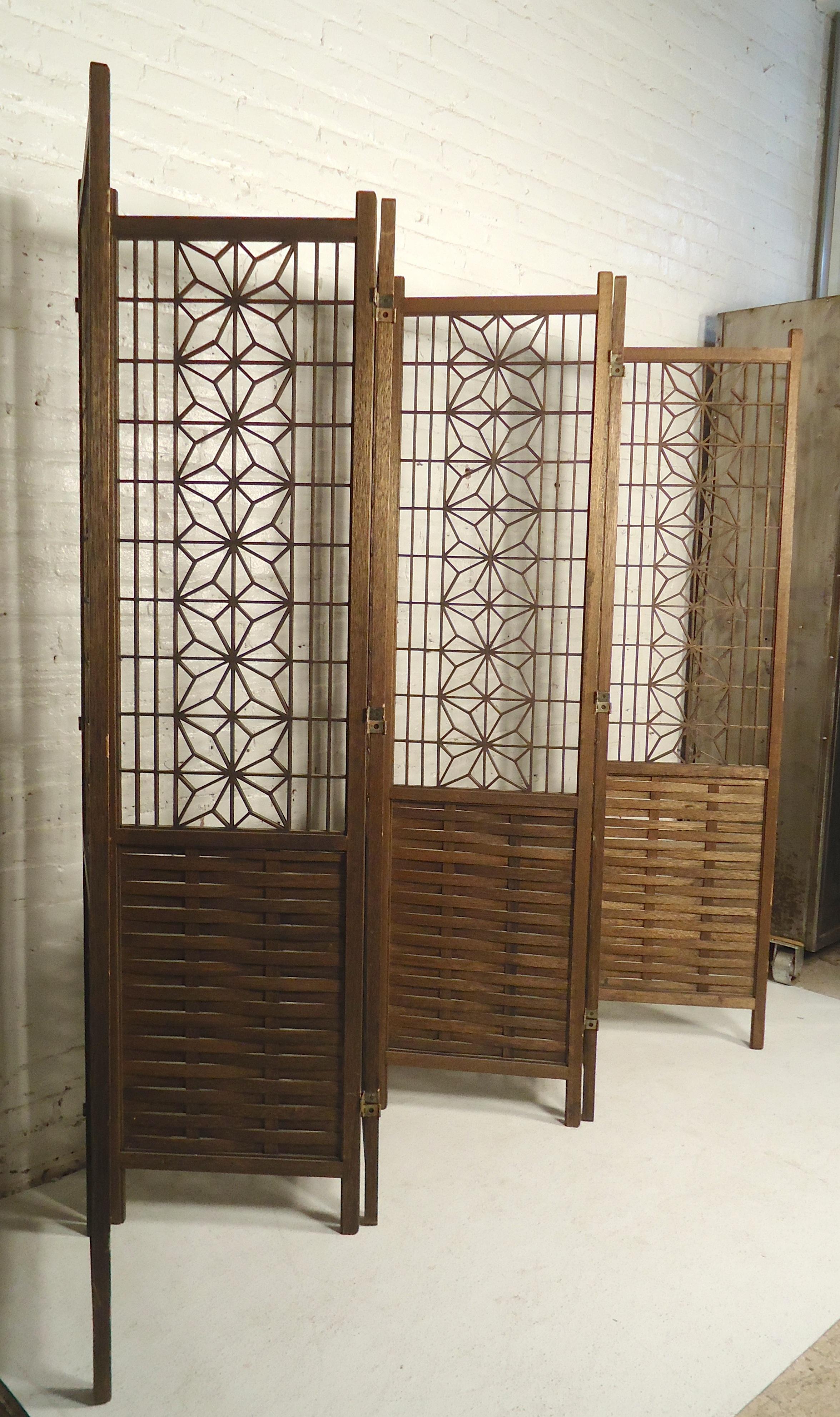 Beautiful teak wood room divider with woven bottom and geometric pattern top portion. 
Each panel is 18