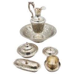 Six-piece chiseled silver toiletry set with bowl, cup, soap dish and more