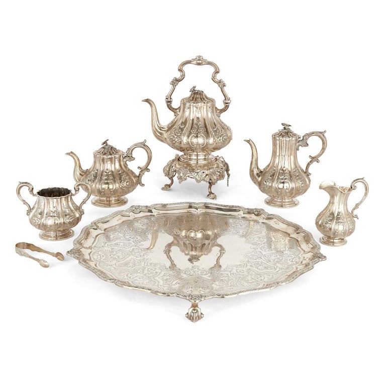 Six-piece English silver tea and coffee service
English, circa 1850-1863
Tray: Height 6cm, width 58cm, depth 58cm
Kettle on stand: Height 43cm, width 29cm, depth 23cm
Weight: 7,150 grammes

This beautiful six-piece coffee and tea service is