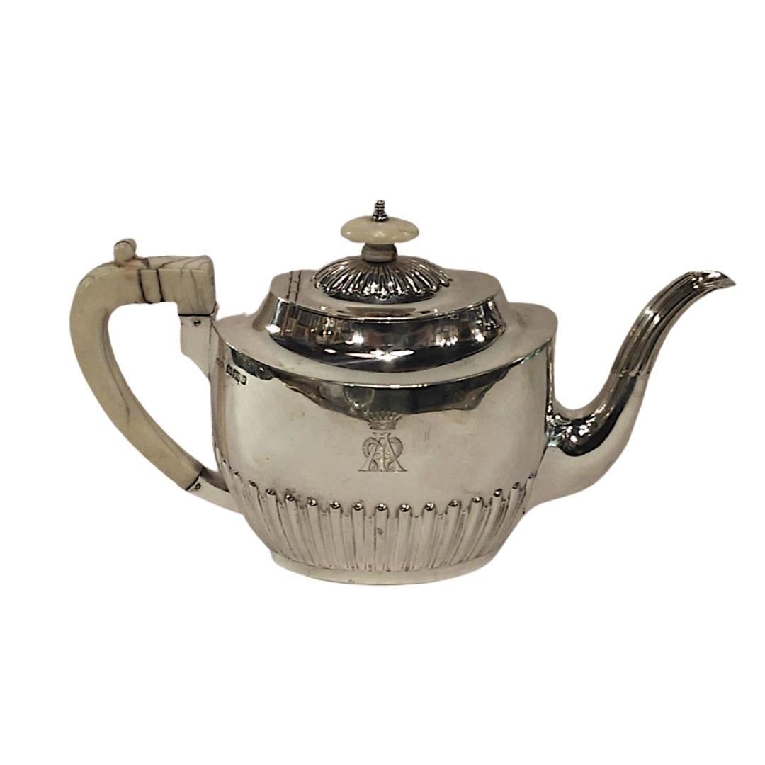 Six-piece sterling silver tea set
Harrison Brothers & Howson, Sheffield, 1893-1896
For Leuchars & Son, Geffroy Succr Paris
The set consists of a silver coffee pot, teapot, sugar pot, cream jug with ivory handles & knobs and burner with a