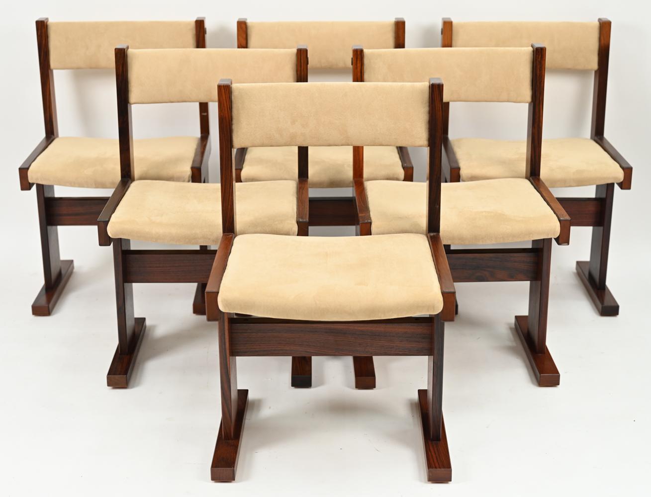 A beautiful set of (6) Scandinavian Modern dining chairs designed by Poul H. Poulsen for Gangso Mobler, c. 1970's. These gorgeous rosewood chairs pair perfectly with his Ox Art design tables and mirror their trestle-style bases with sturdy