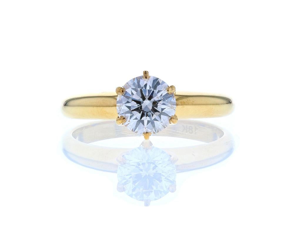 This elegant Six Prong Crown Basket Diamond Engagement Ring In Yellow Gold features a brilliant round cut center stone and is gently set in a head-on-shank style setting held in place by six delicate eagle claw prongs. Slightly tapered toward the