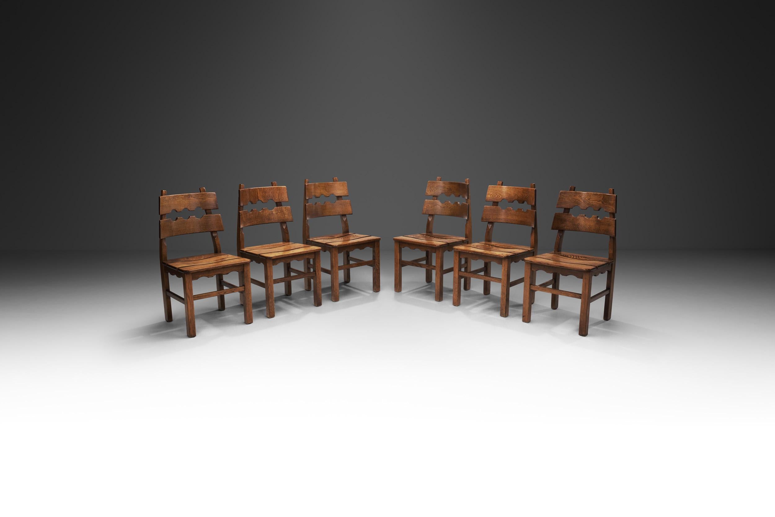 This rare set bears the unmistakeable oak structures created Danish designer and craftsman, Henning Kjaernulf with the distinctive “razorblade” backs. This set was manufactured by the Danish company, Nyrup Møbelfabrik during the 1970s and has an