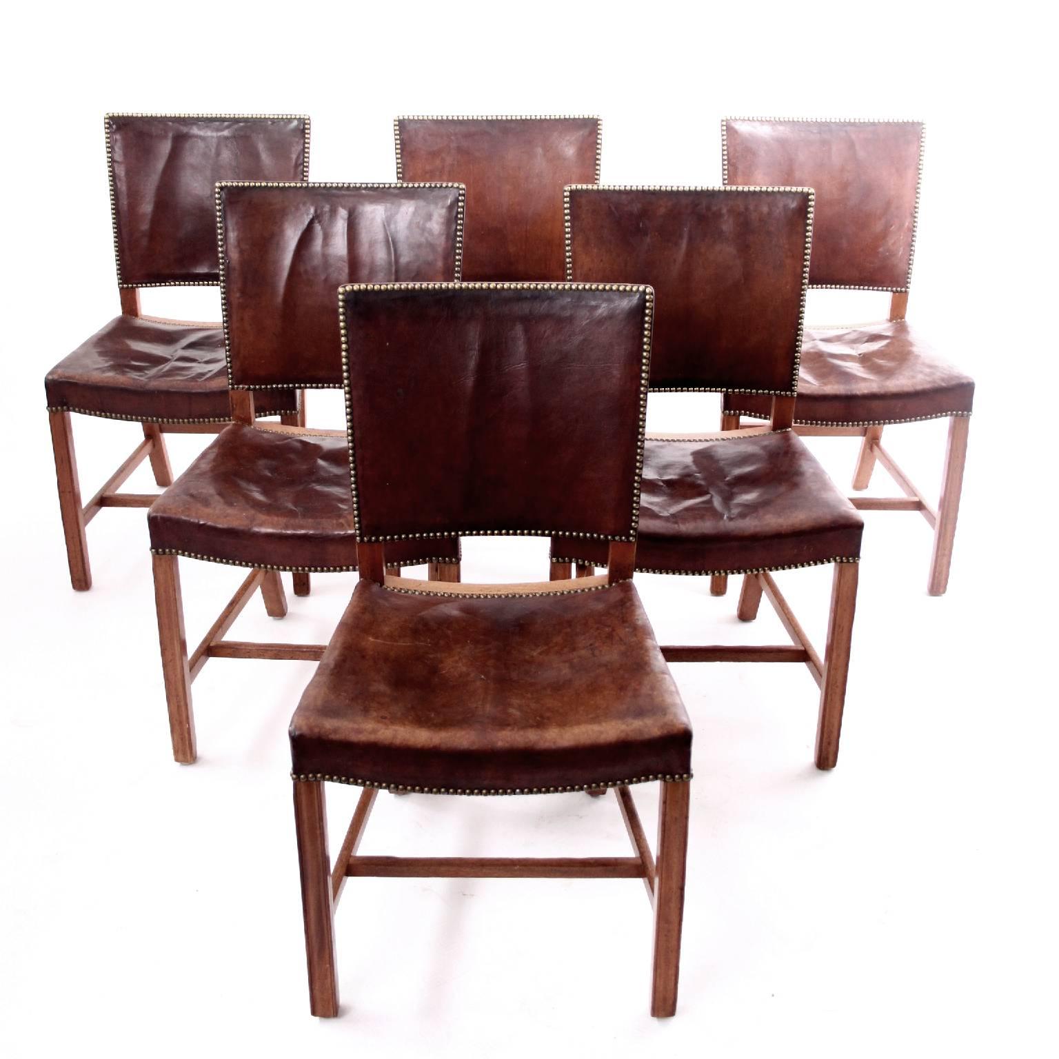 KAARE KLINT & RUD RASMUSSEN SNEDKERIER  -  SCANDINAVIAN MODERN

A set of six very early Kaare Klint 'Red Chairs', small model, all from the same provenance, hence same level of patina.  

Profiled legs of mahogany, seat and back upholstered with
